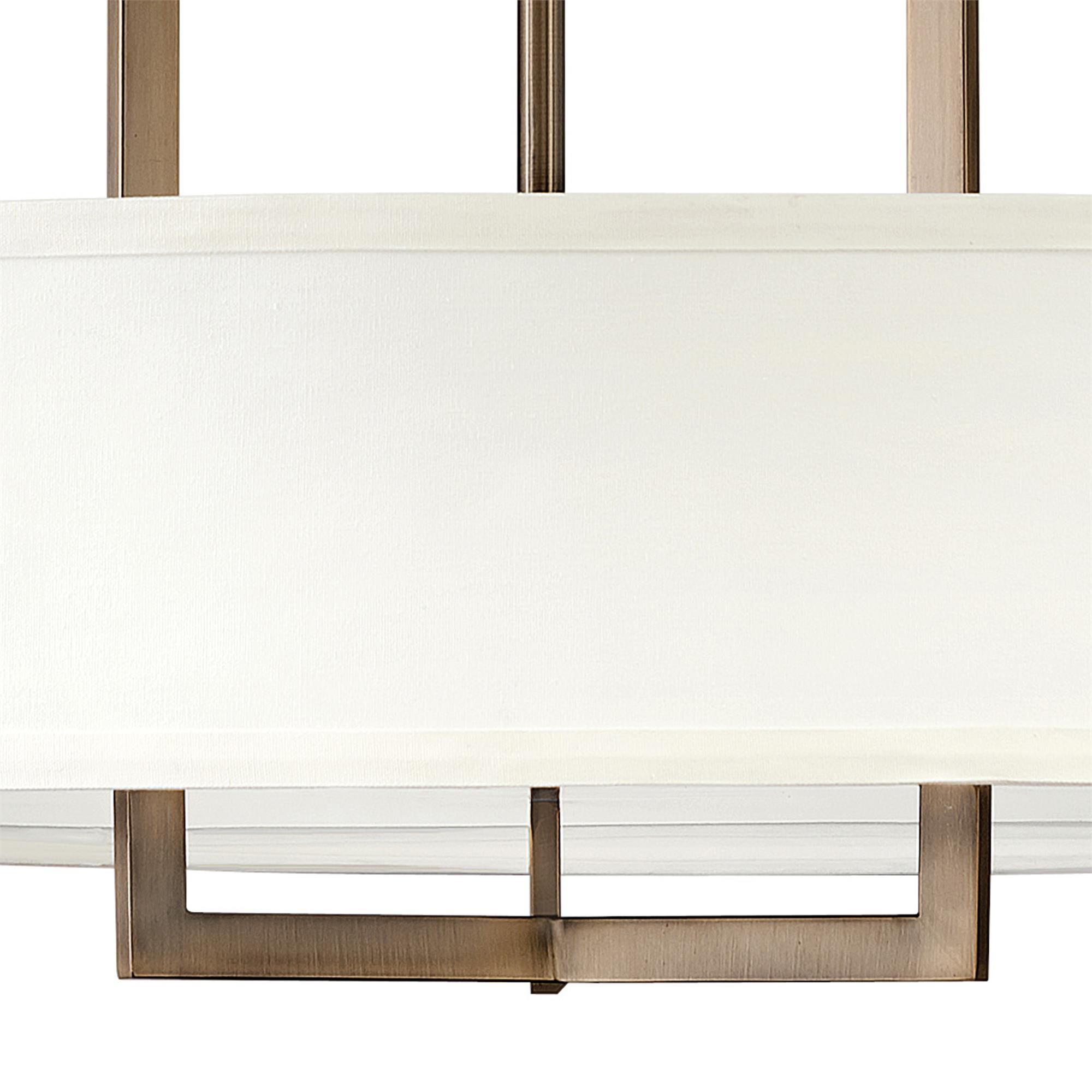 Shown in Brushed Bronze finish and Off-White Linen Hardback shade