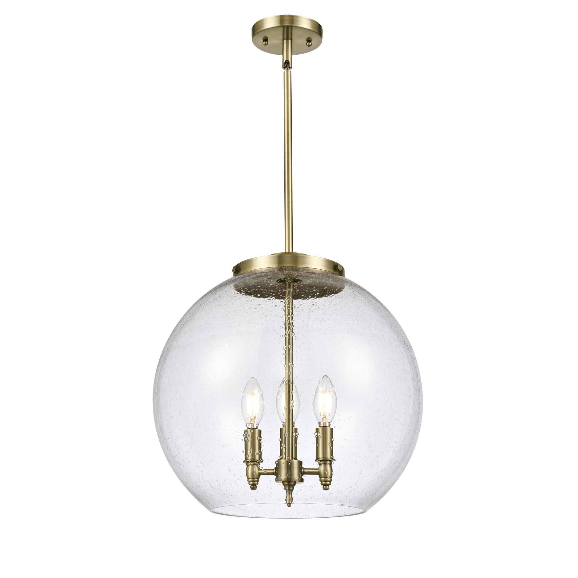 Shown in Antique Brass finish and Seedy Large Athens glass