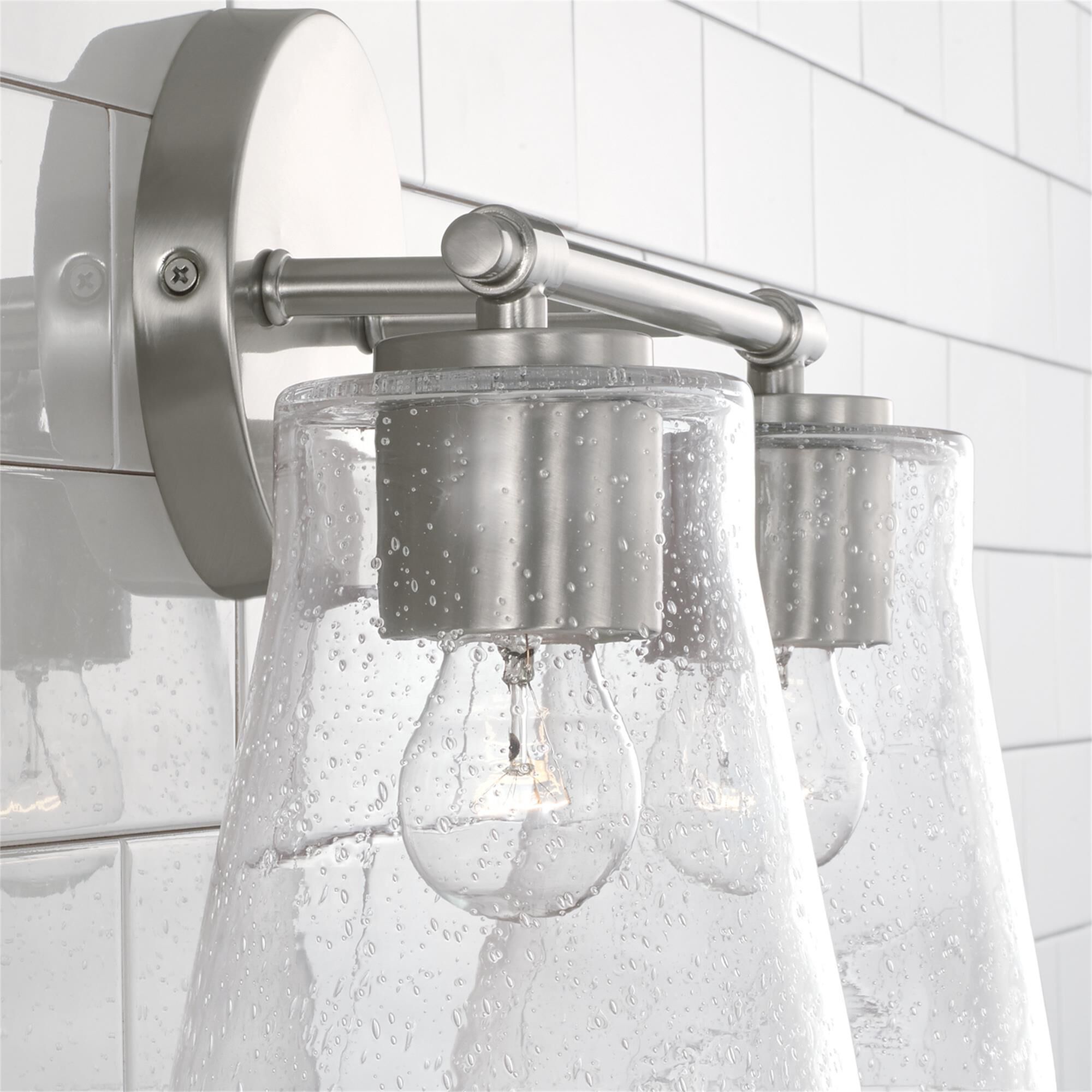Shown in Brushed Nickel finish and Clear Seeded glass