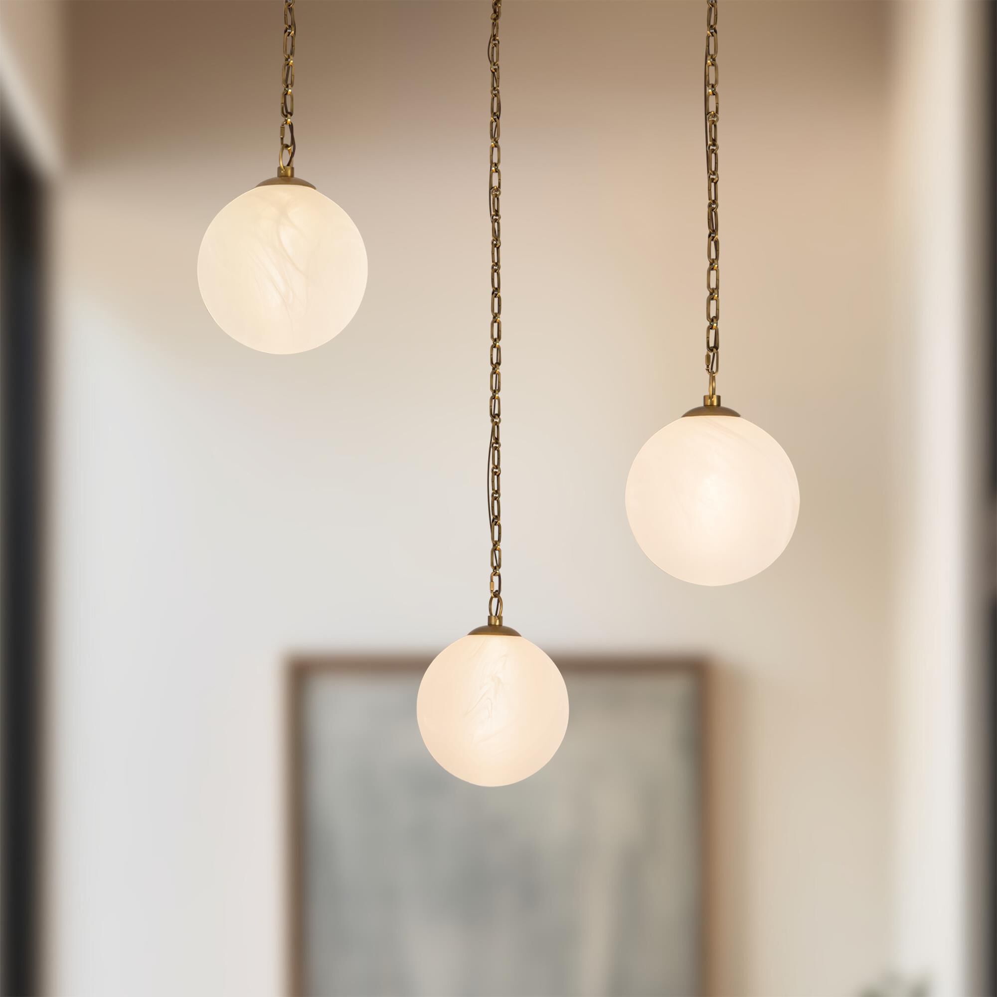 Shown in Vintage Brass finish and Cloud glass