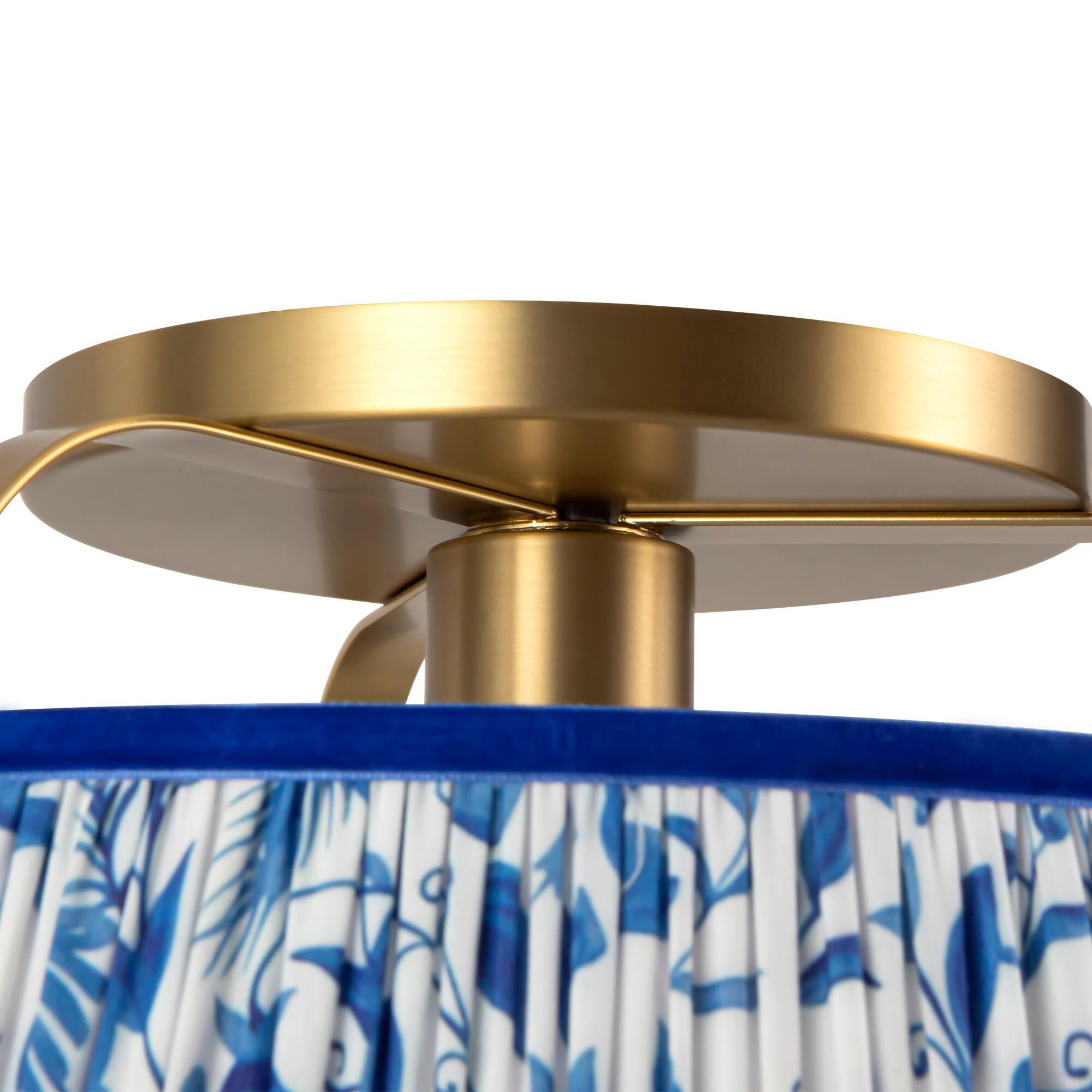 Shown in Brushed Gold finish and Frosted Polycarbonate Diffuser glass and Blue Linen shade