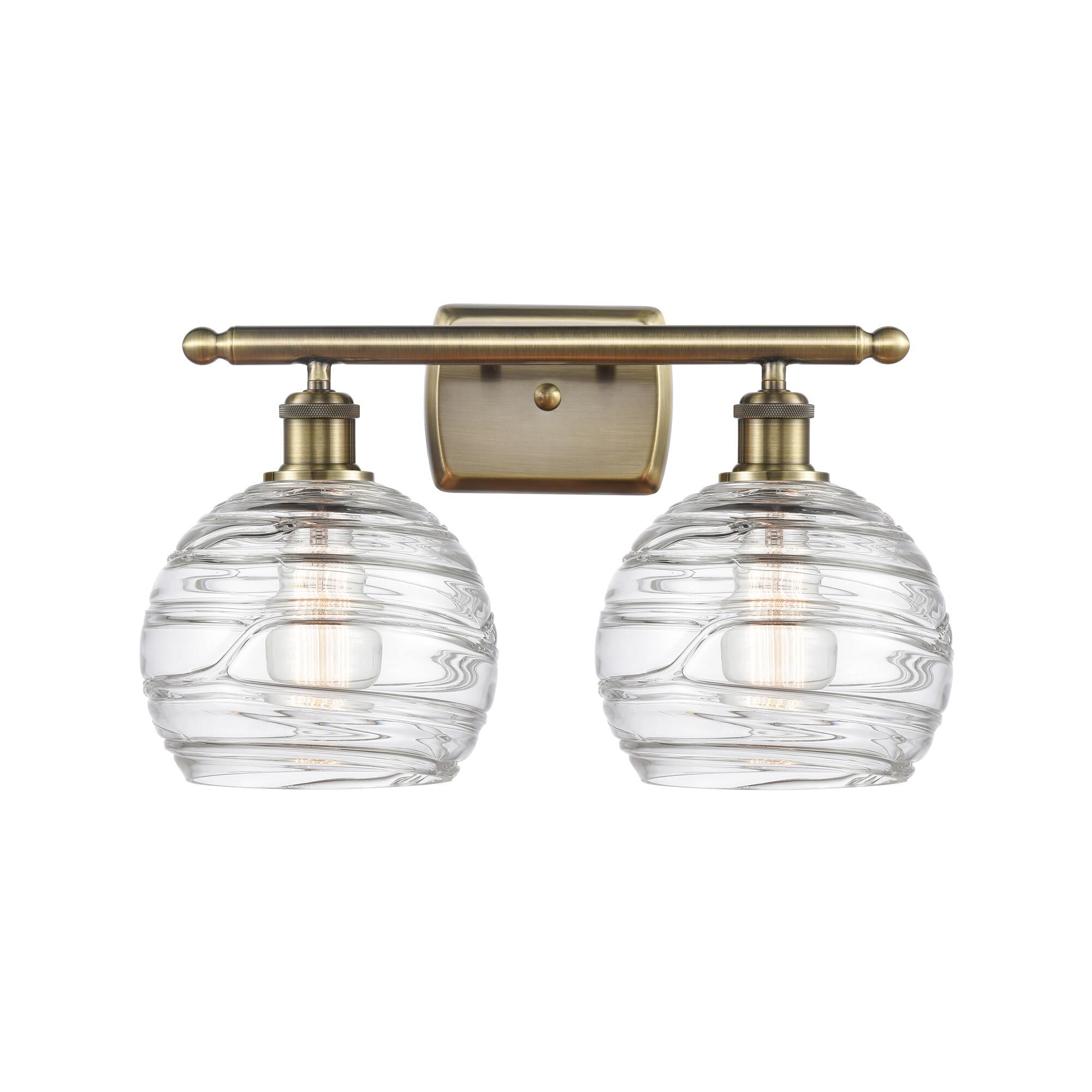 Shown in Antique Brass finish and Sphere glass and Glass shade
