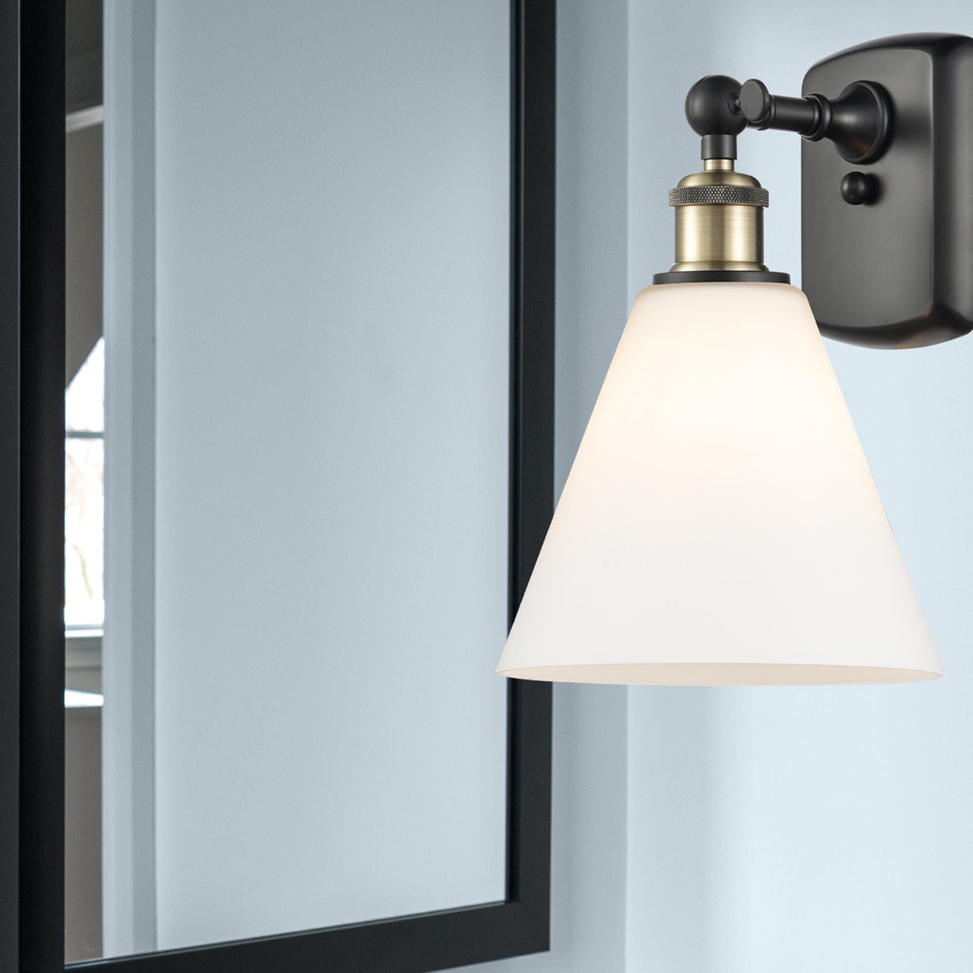 Shown in Black Antique Brass finish and Cased Matte White Ballston Cone glass and No Shade shade