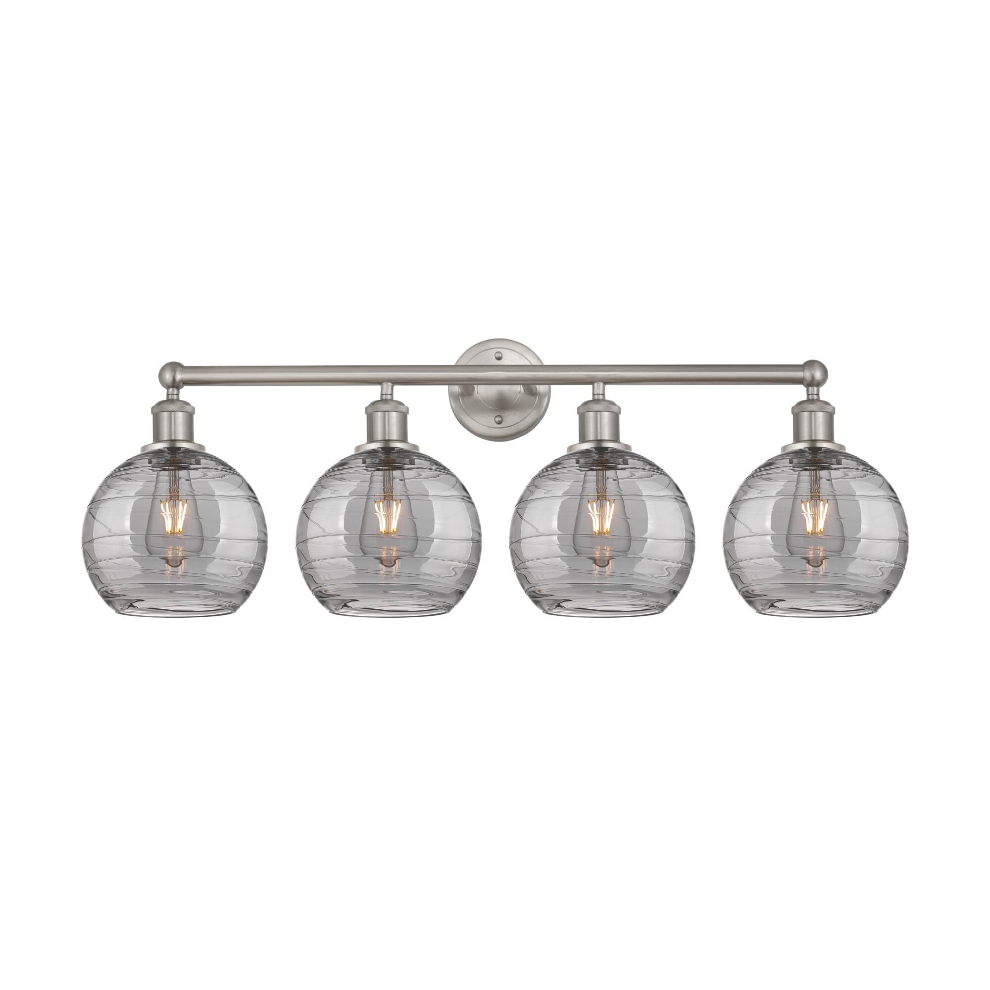 Shown in Satin Nickel finish and Light Smoke Deco Swirl glass