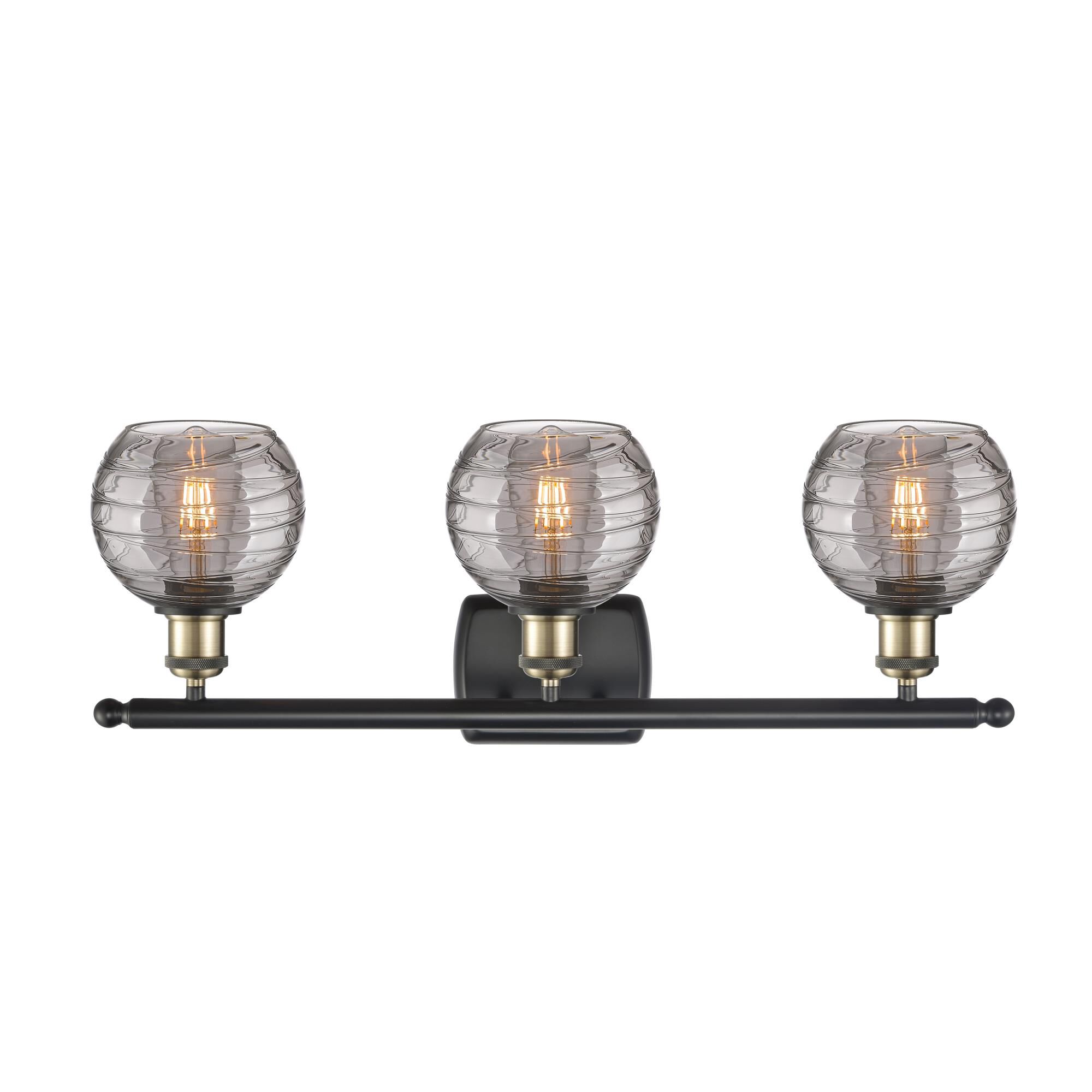 Shown in Black Antique Brass finish and Light Smoke Deco Swirl glass