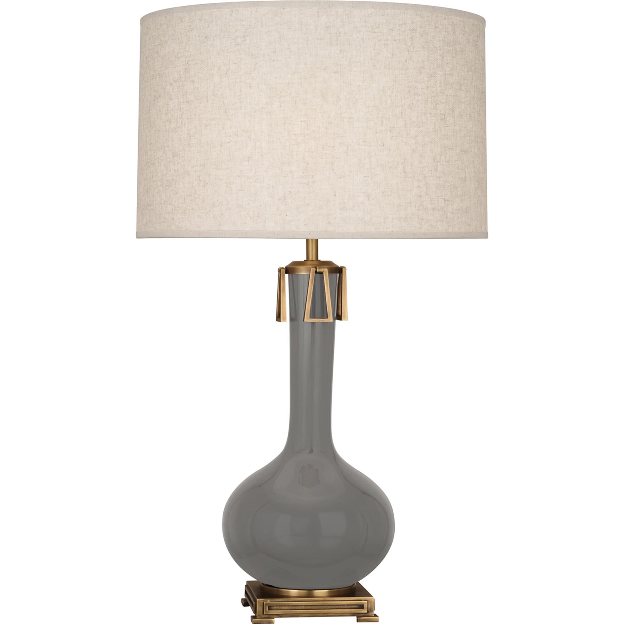 Shown in Smoky Taupe Glazed Ceramic With Aged Brass Accents finish and Open Weave Heather Linen shade