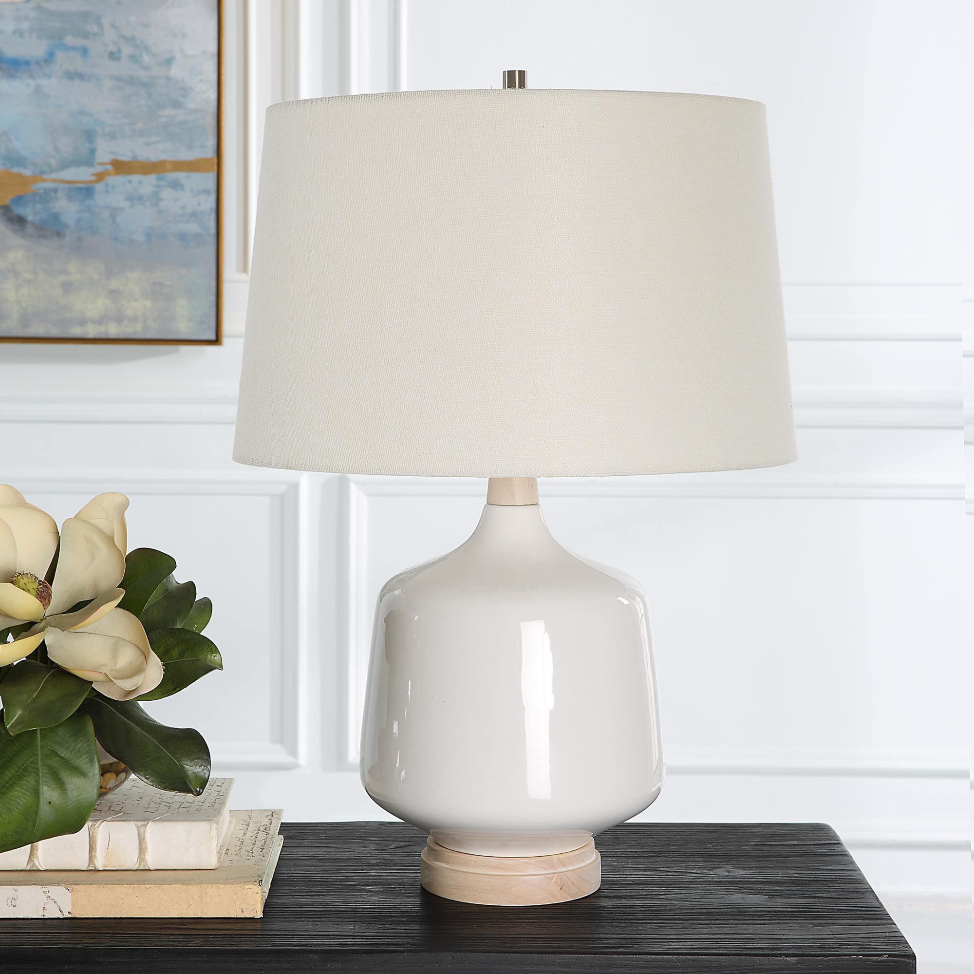 Shown in This Ceramic Table Lamp Featuring A White High Gloss Glaze Accented By Brushed Nickel Finishes. The  finish and Round Hardback shade