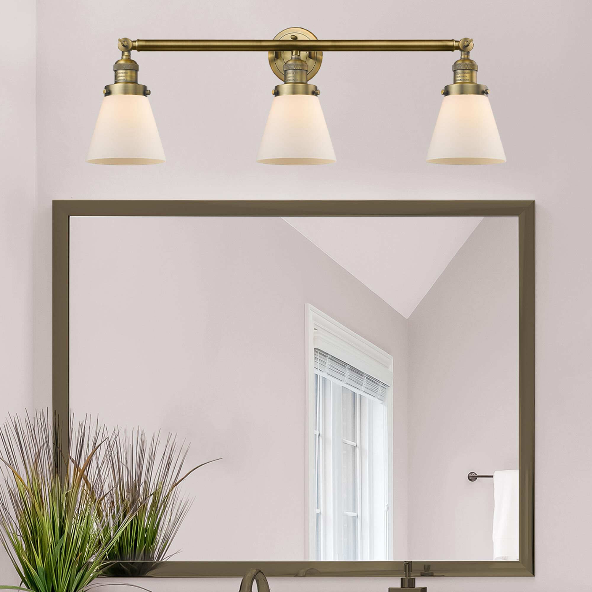 Shown in Brushed Brass finish and Matte White Cased glass