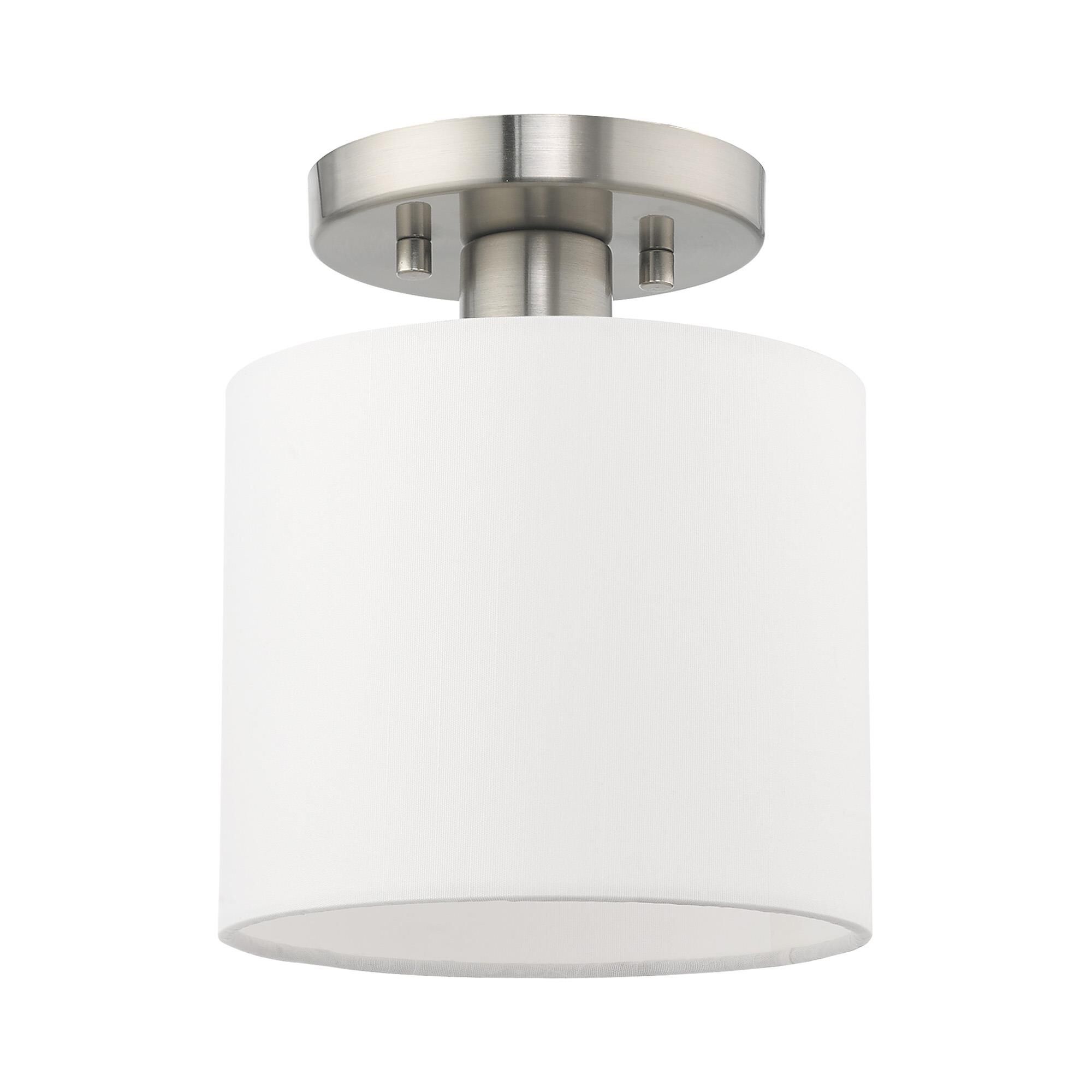 Shown in Brushed Nickel finish and Hand Crafted Off-White Fabric Hardback shade