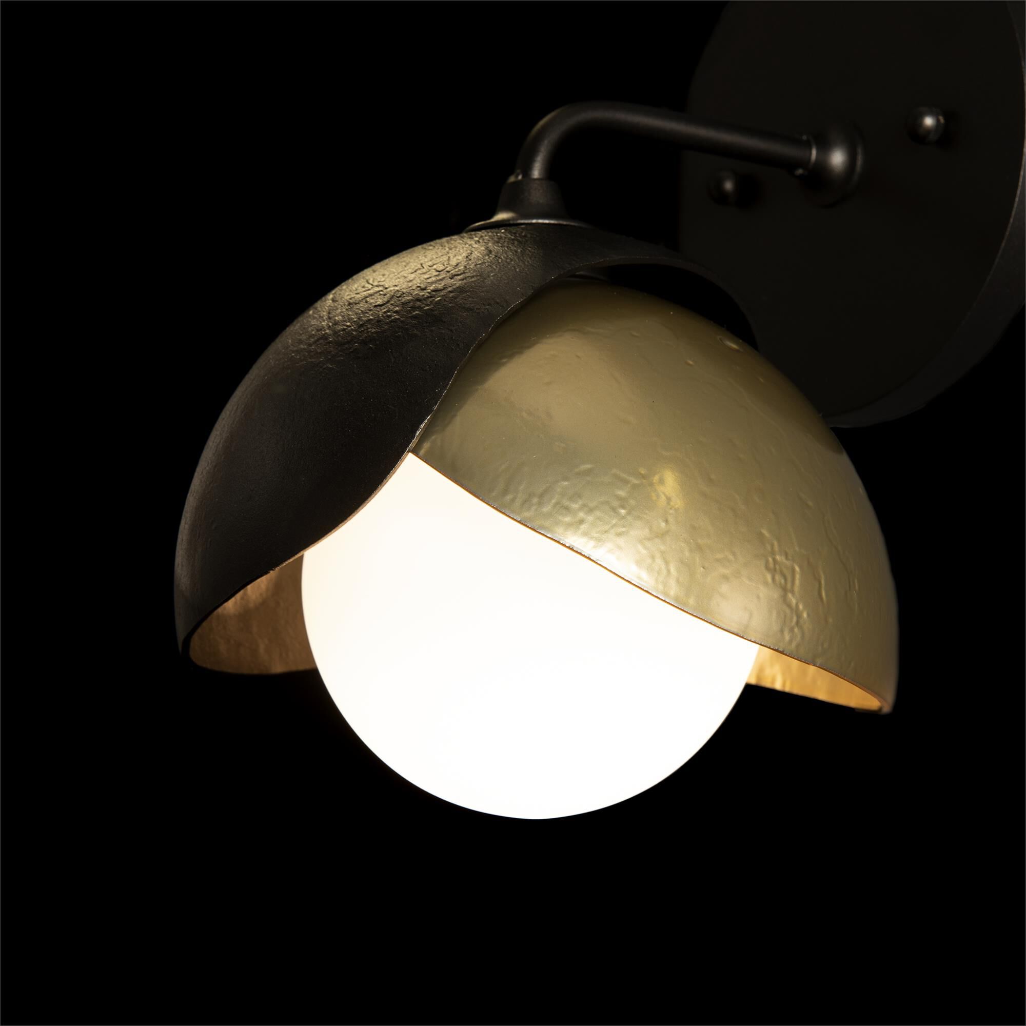Shown in Oil Rubbed Bronze finish and Opal glass and Modern Brass (86) accent