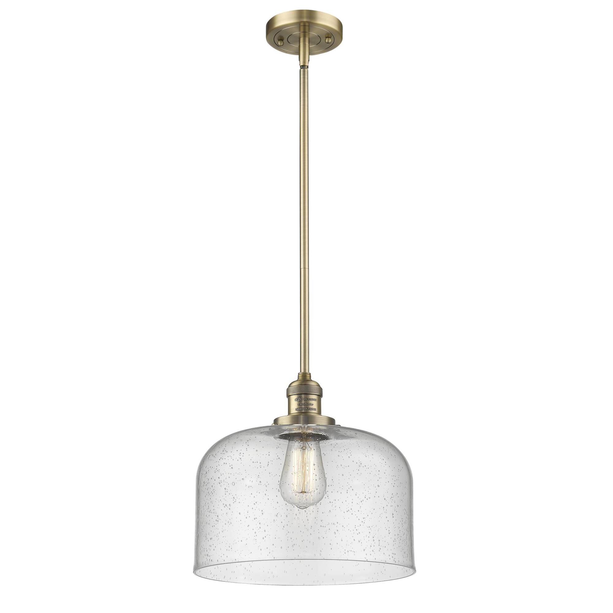 Shown in Brushed Brass finish and Seedy glass