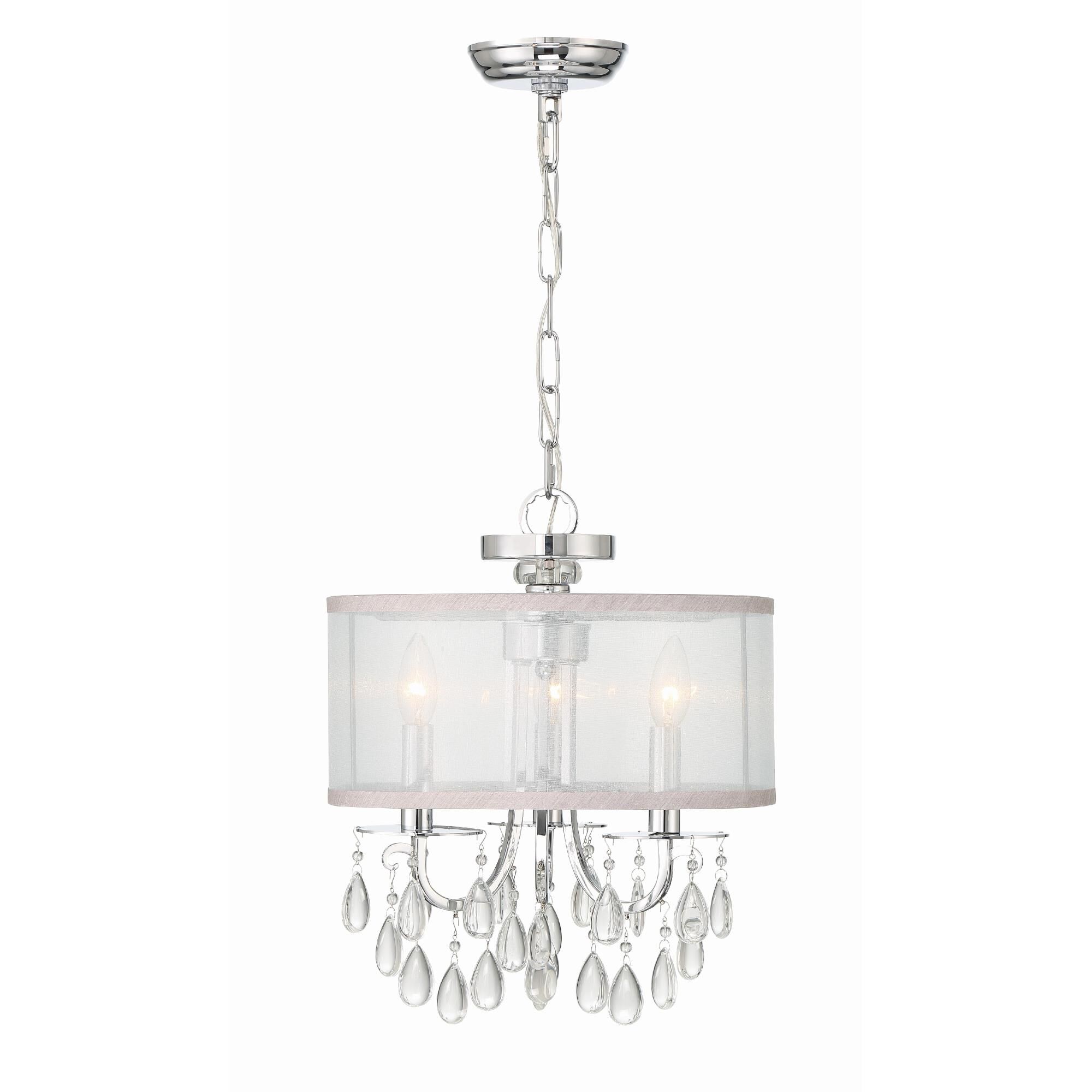 Shown in Polished Chrome finish and Clear Teardrop Almond crystal and Silk glass and Silk shade