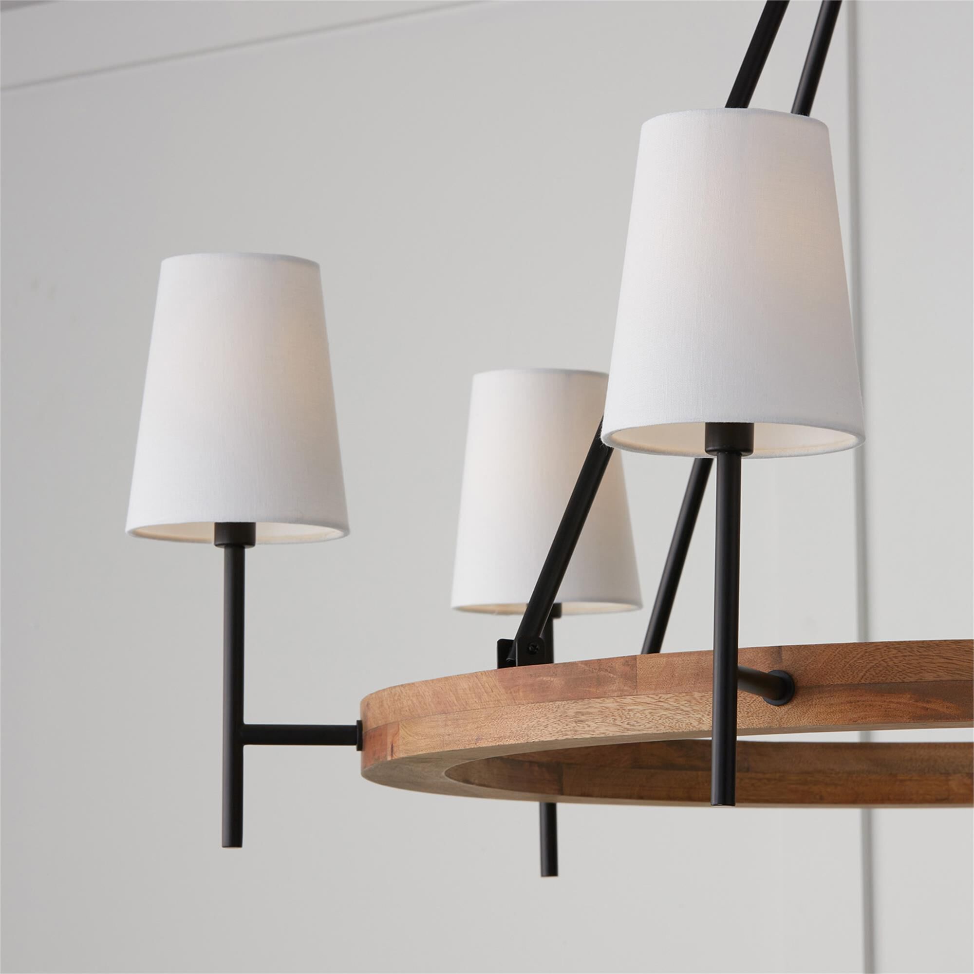 Shown in Light Wood And Matte Black finish and White Fabric Stay-Straight s shade