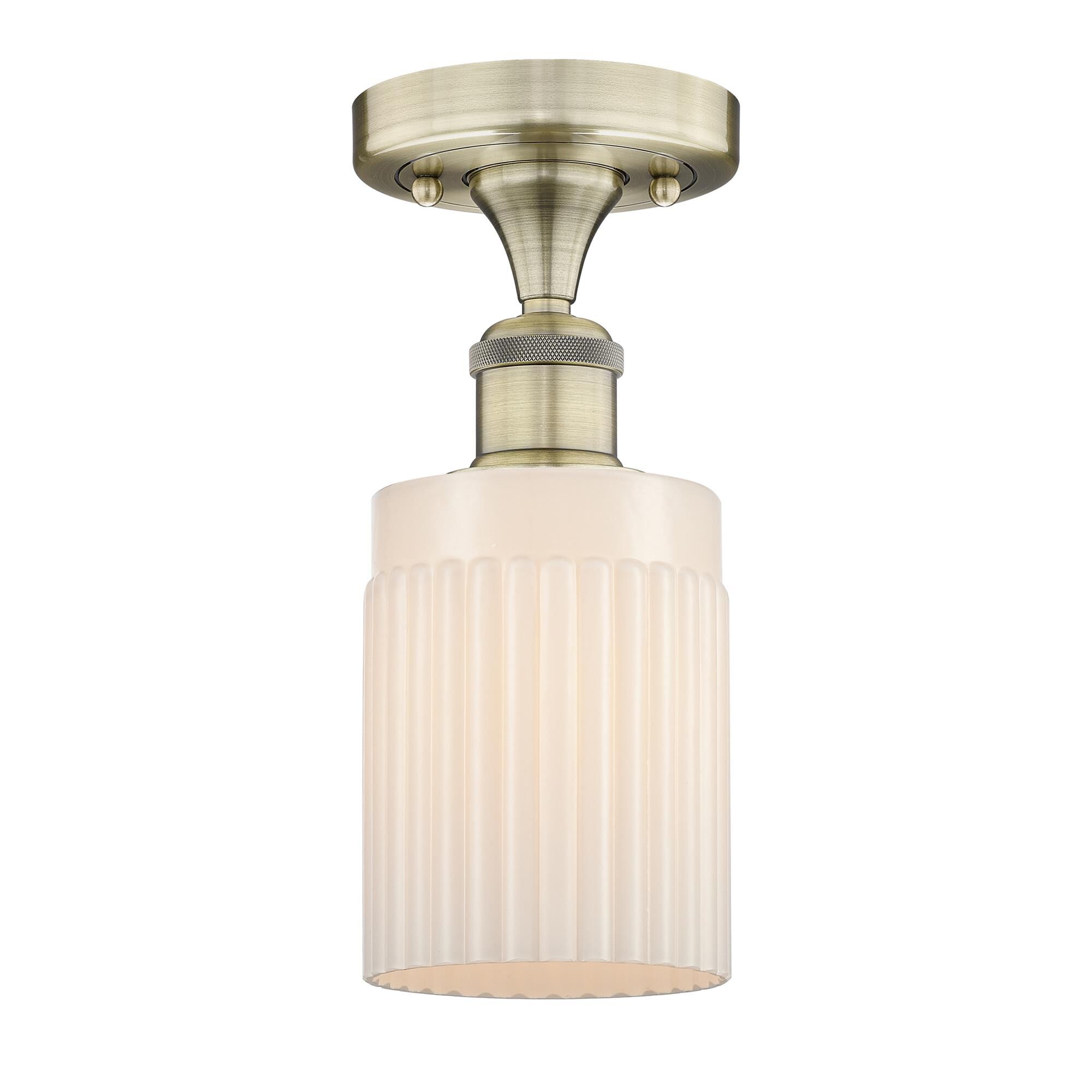 Shown in Antique Brass finish and Matte White glass