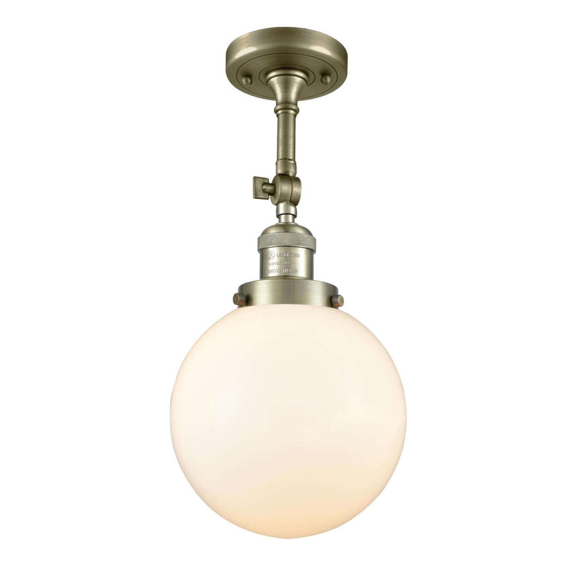Shown in Antique Brass finish and Matte White Cased glass and No Accent accent