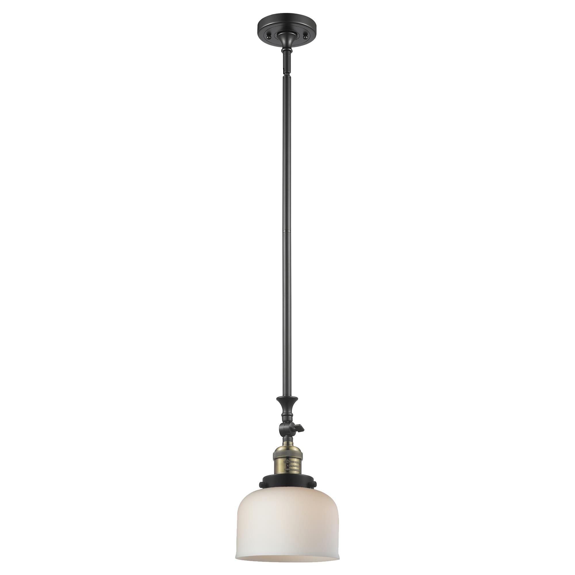 Shown in Black Antique Brass finish and Matte White Cased glass