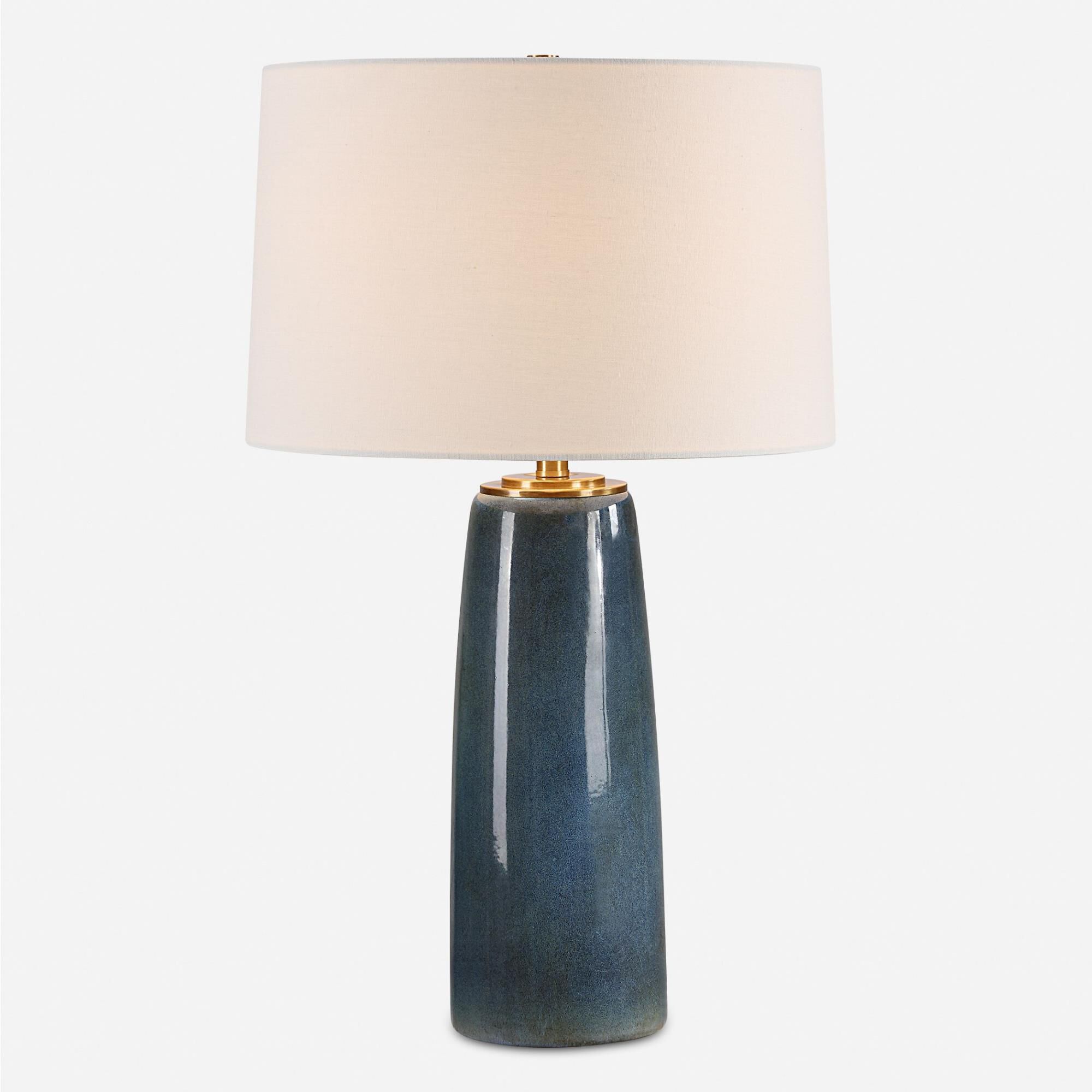 Shown in This Ceramic Table Lamp Showcases A Deep Blue Glaze With Rustic Undertones, Accented With Plated Ant finish and Round Hardback shade