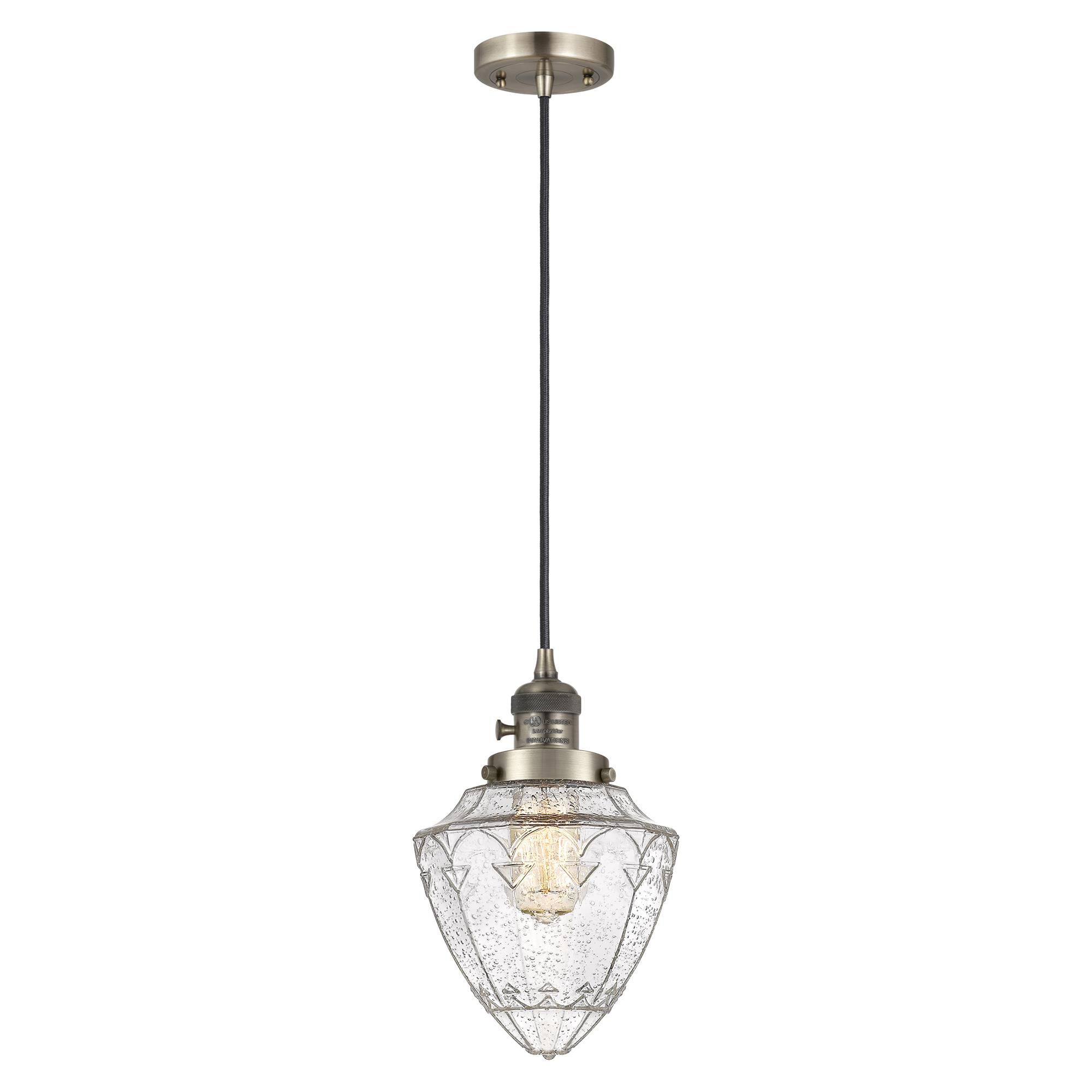 Shown in Antique Brass finish and Seedy Small Bullet glass