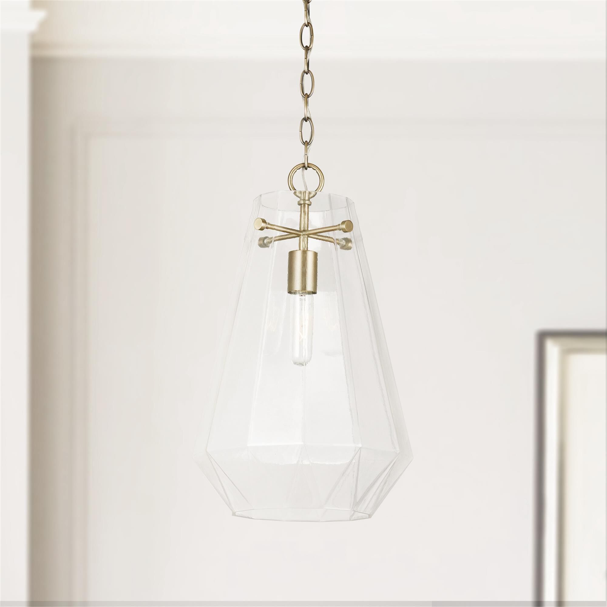 Shown in Aged Brass finish and Clear Prismatic glass