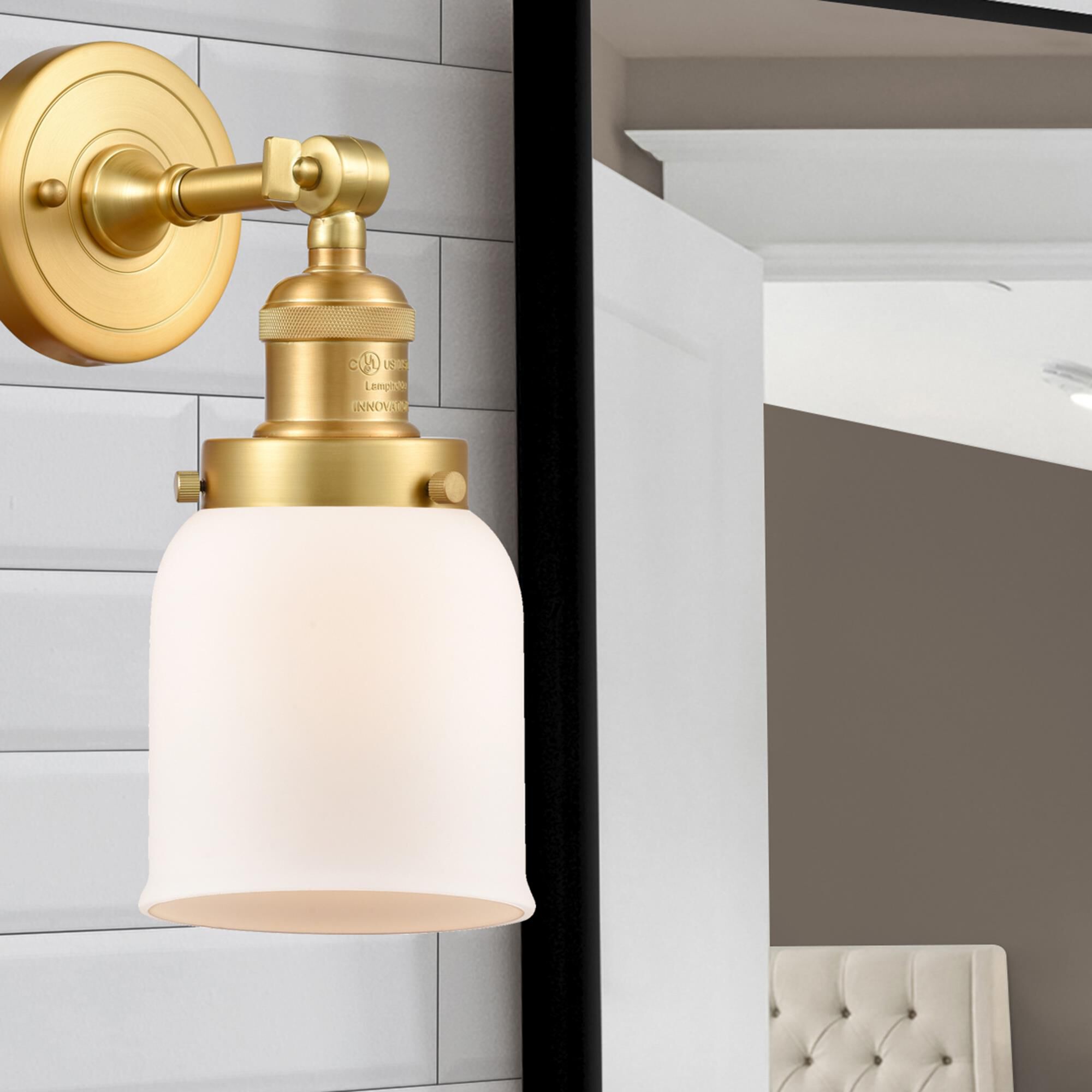 Shown in Satin Gold finish and Matte White Cased Small Bell glass