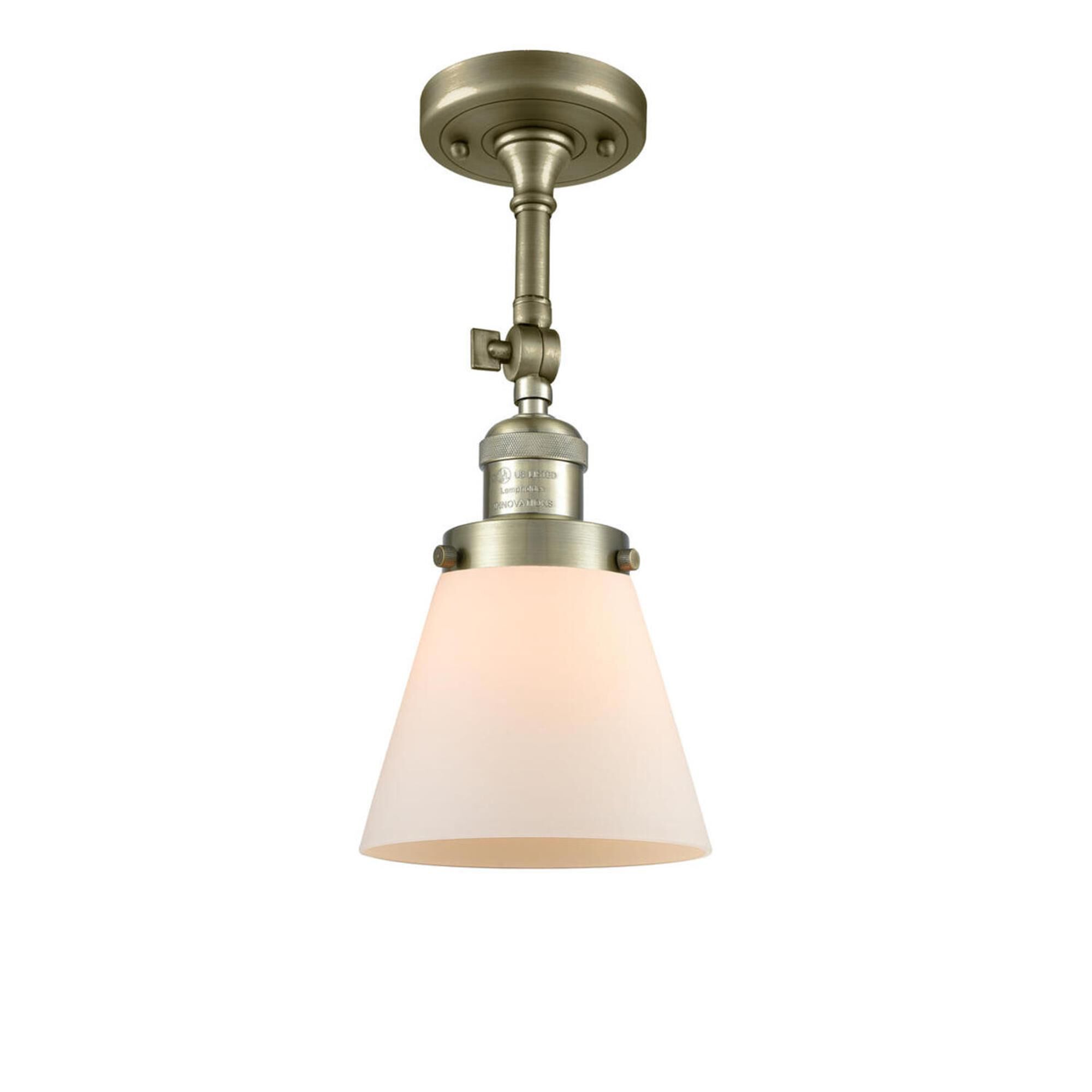 Shown in Antique Brass finish and Frosted glass and None accent