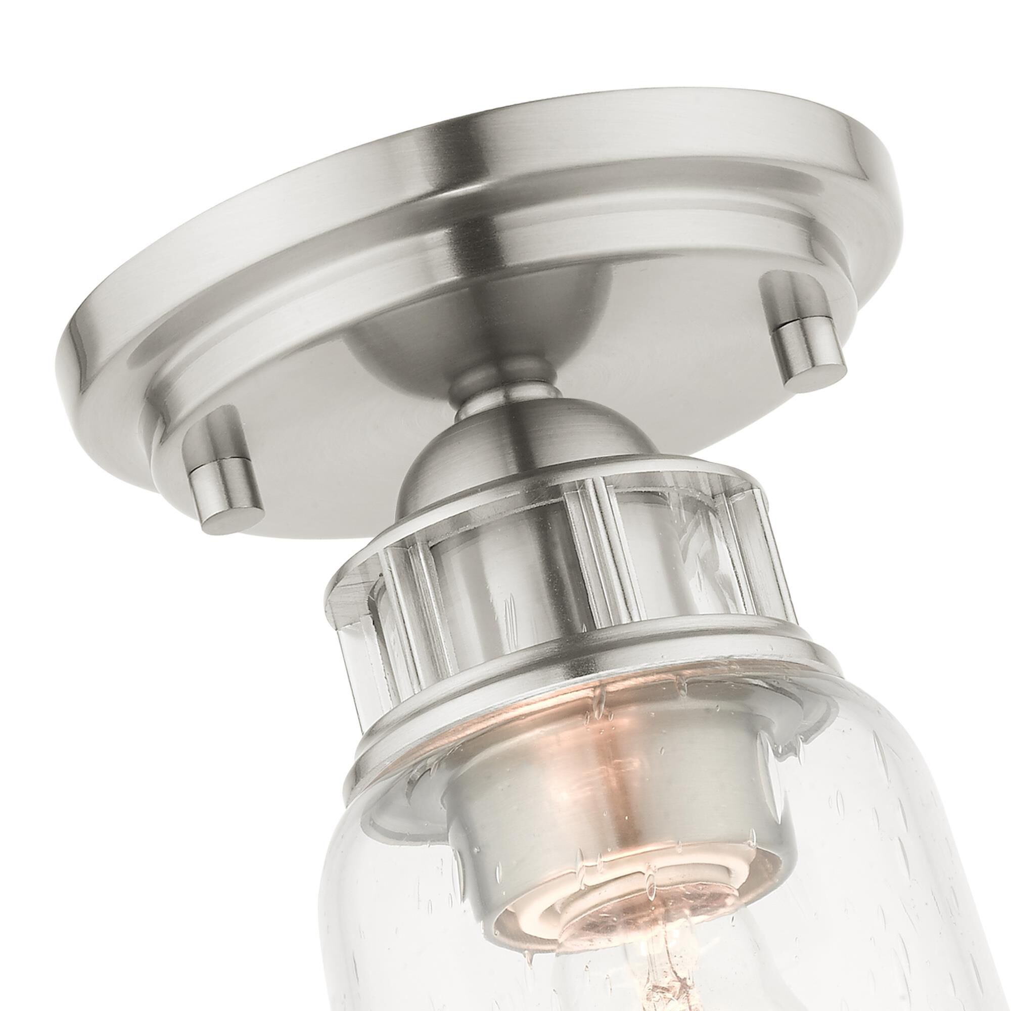 Shown in Brushed Nickel finish and Hand Blown Clear Seeded glass