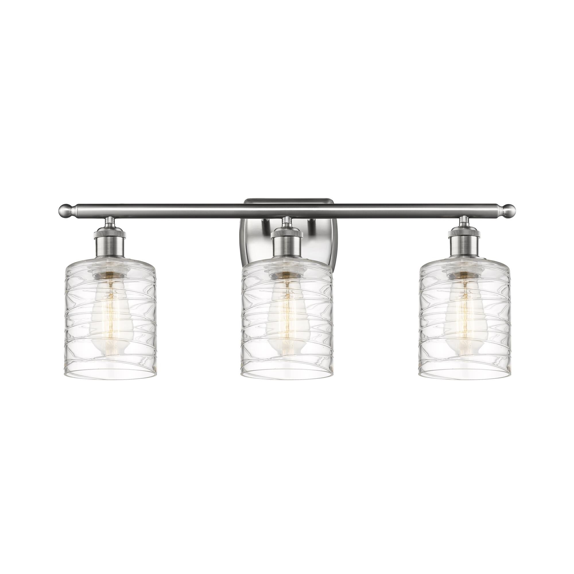 Shown in Brushed Satin Nickel finish and Deco Swirl Cobbleskill glass