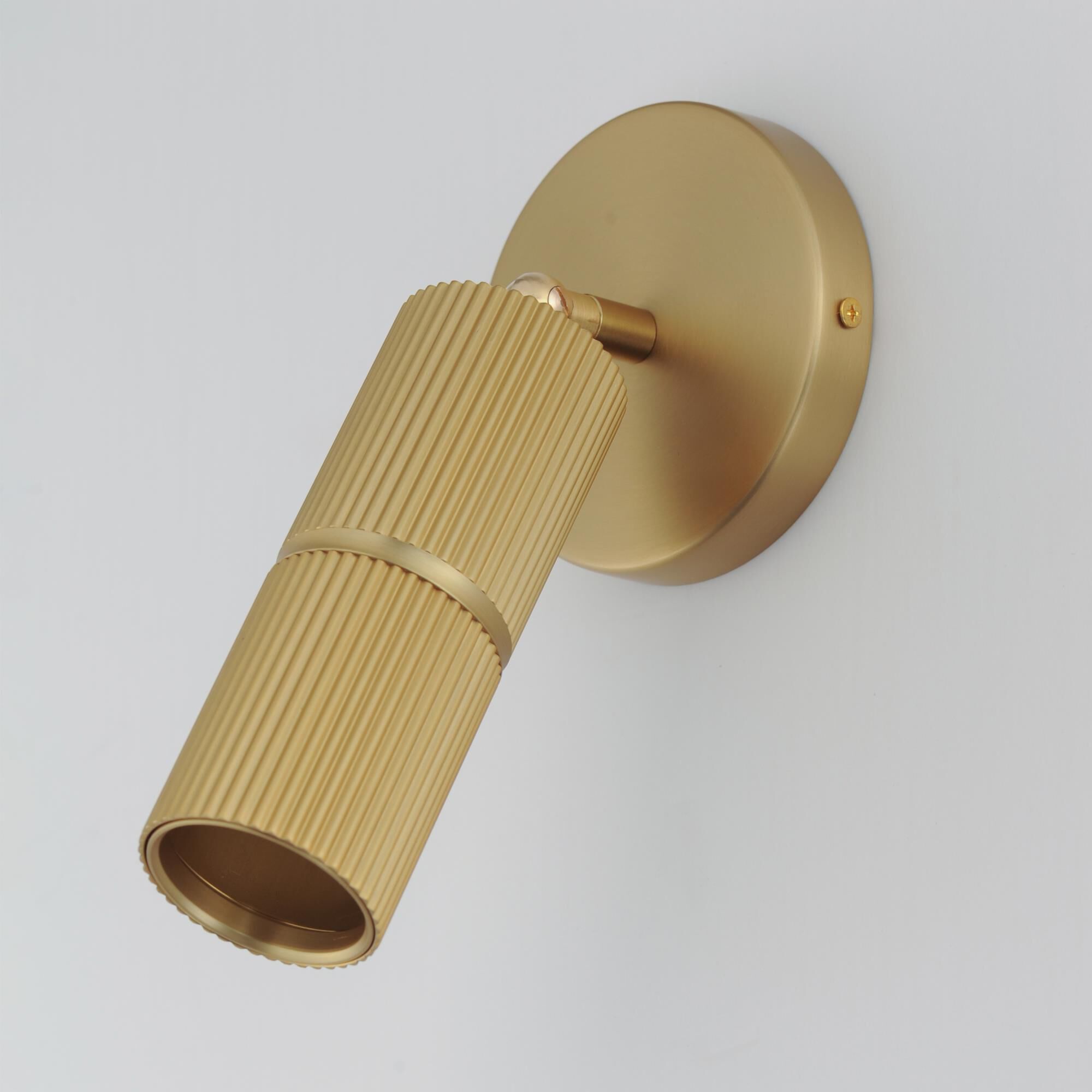 Shown in Gold finish and Clear Ribbed glass