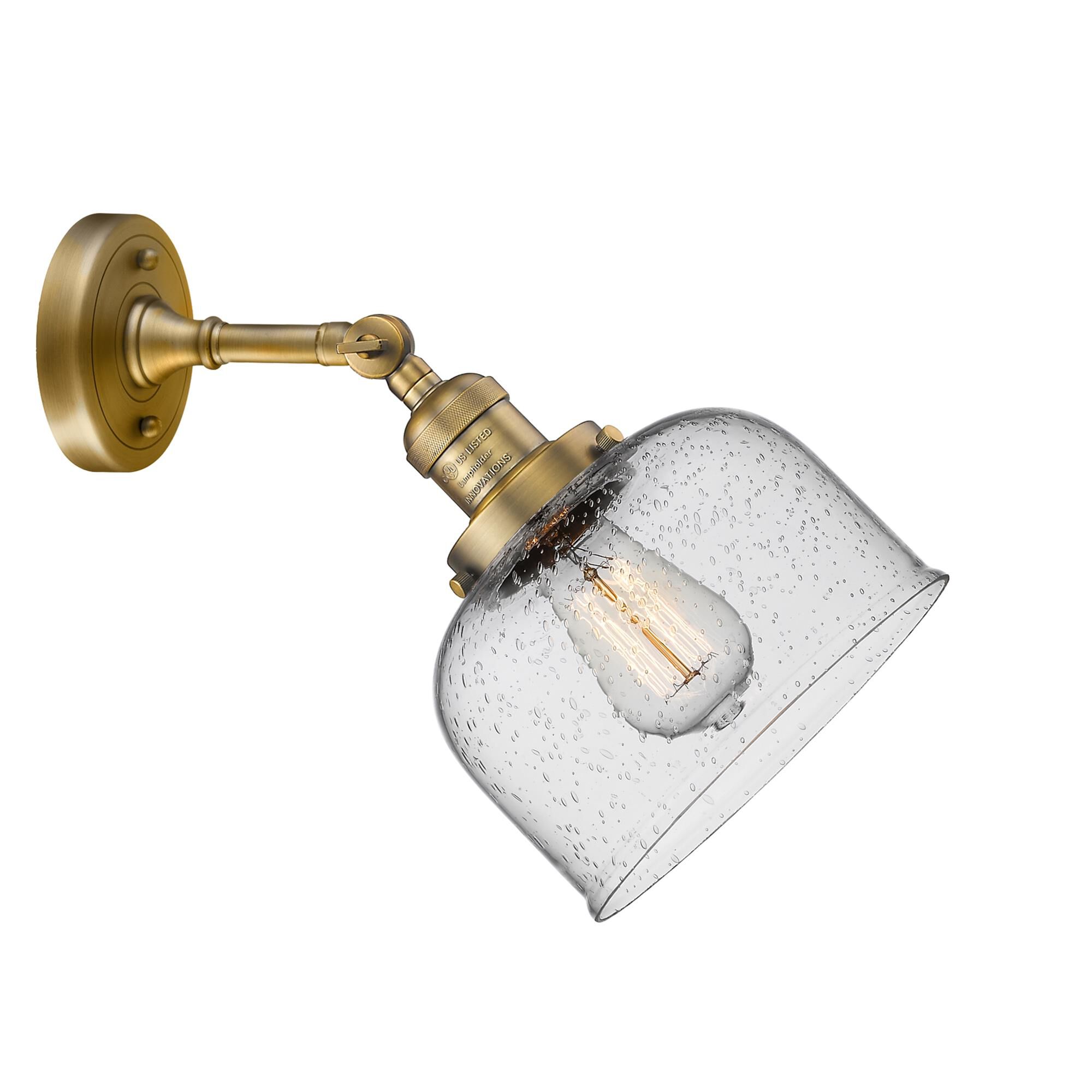 Shown in Brushed Brass finish and Seedy glass and None accent