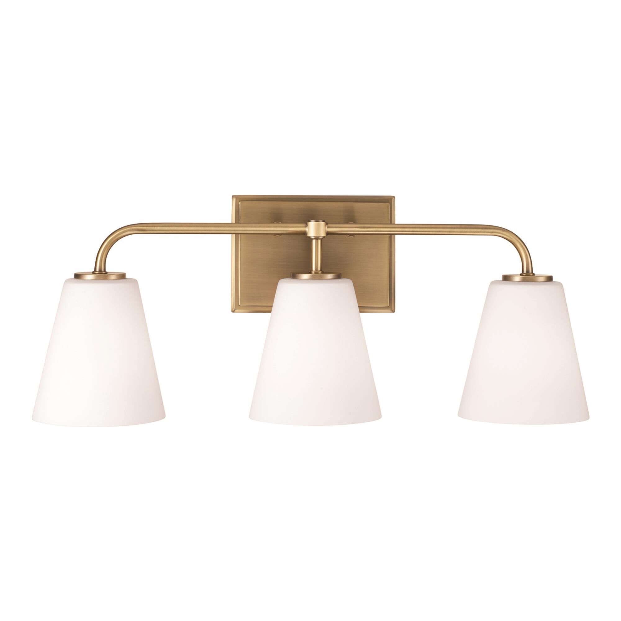 Shown in Aged Brass finish and Soft White glass