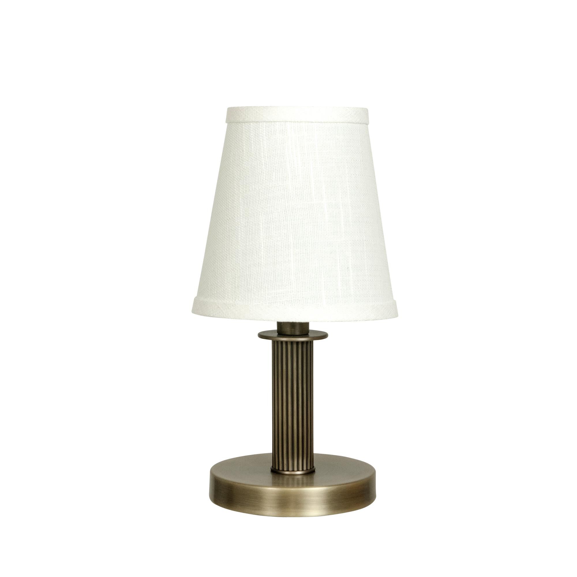 Shown in Antique Brass finish and Natural Linen Hardback shade