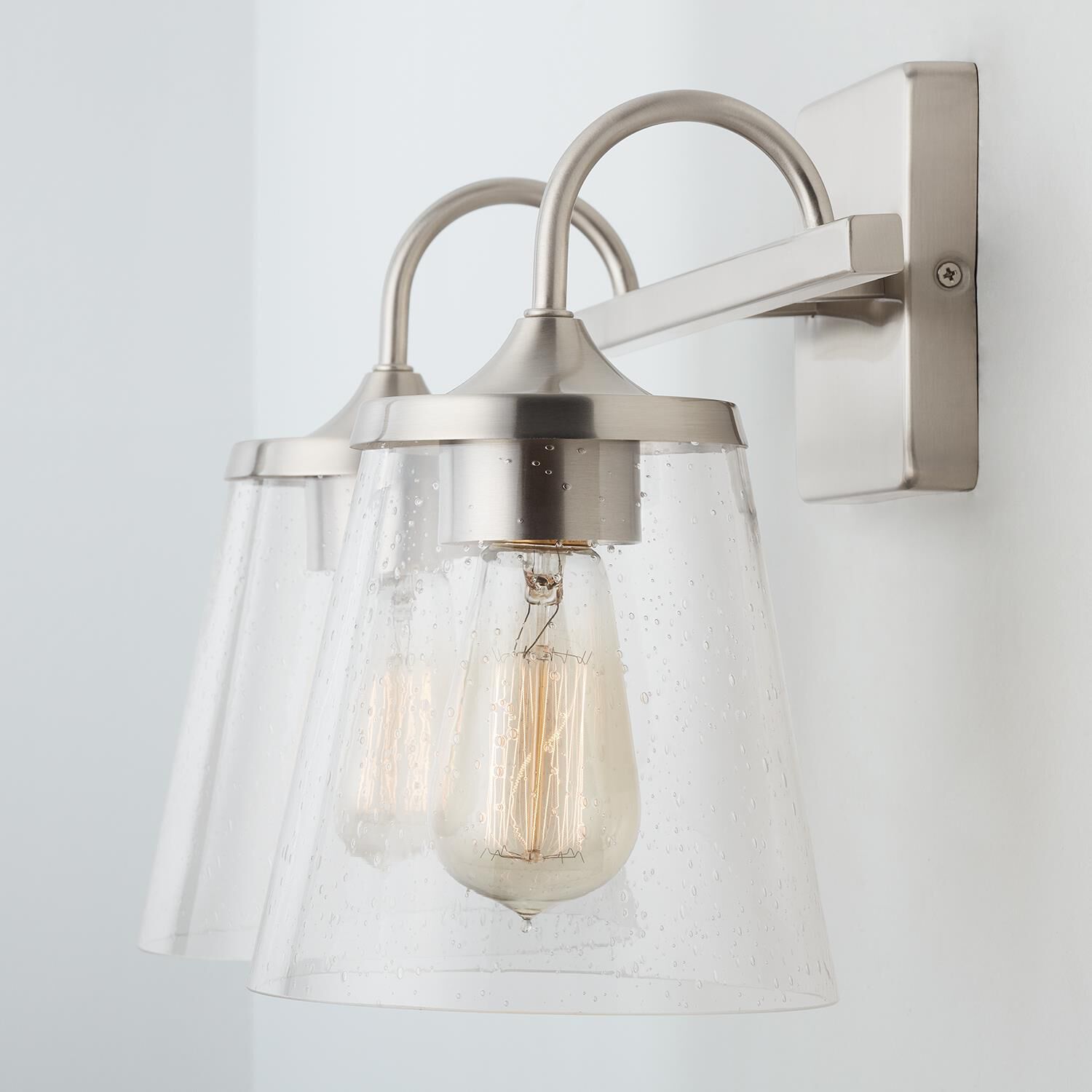 Shown in Brushed Nickel finish and Clear Seeded glass