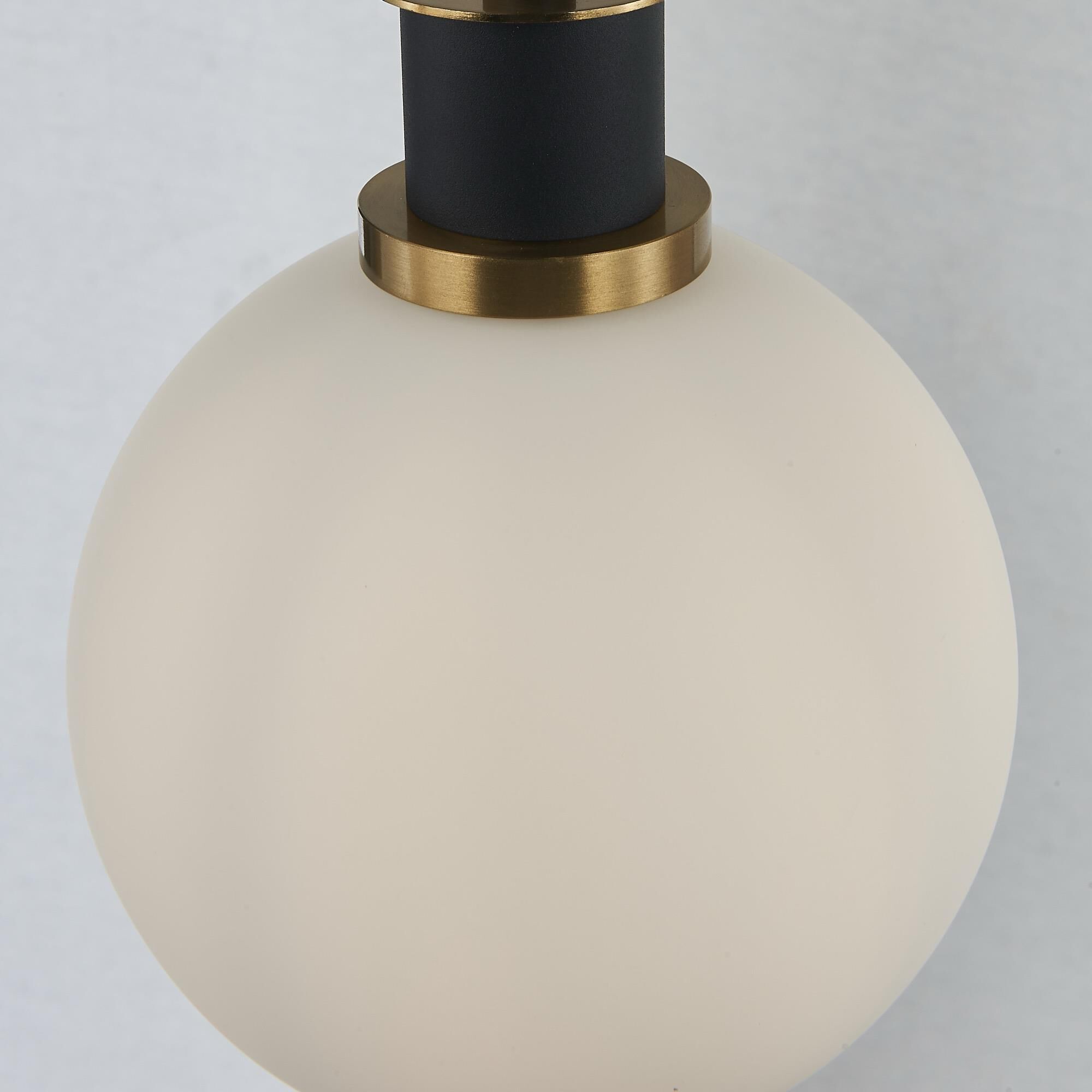 Shown in Black and Brushed Brass finish and White glass