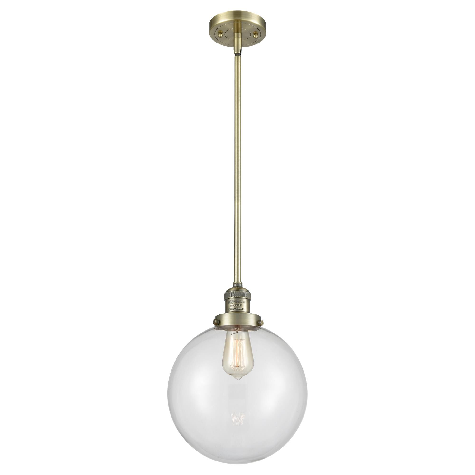 Shown in Antique Brass finish and Clear glass