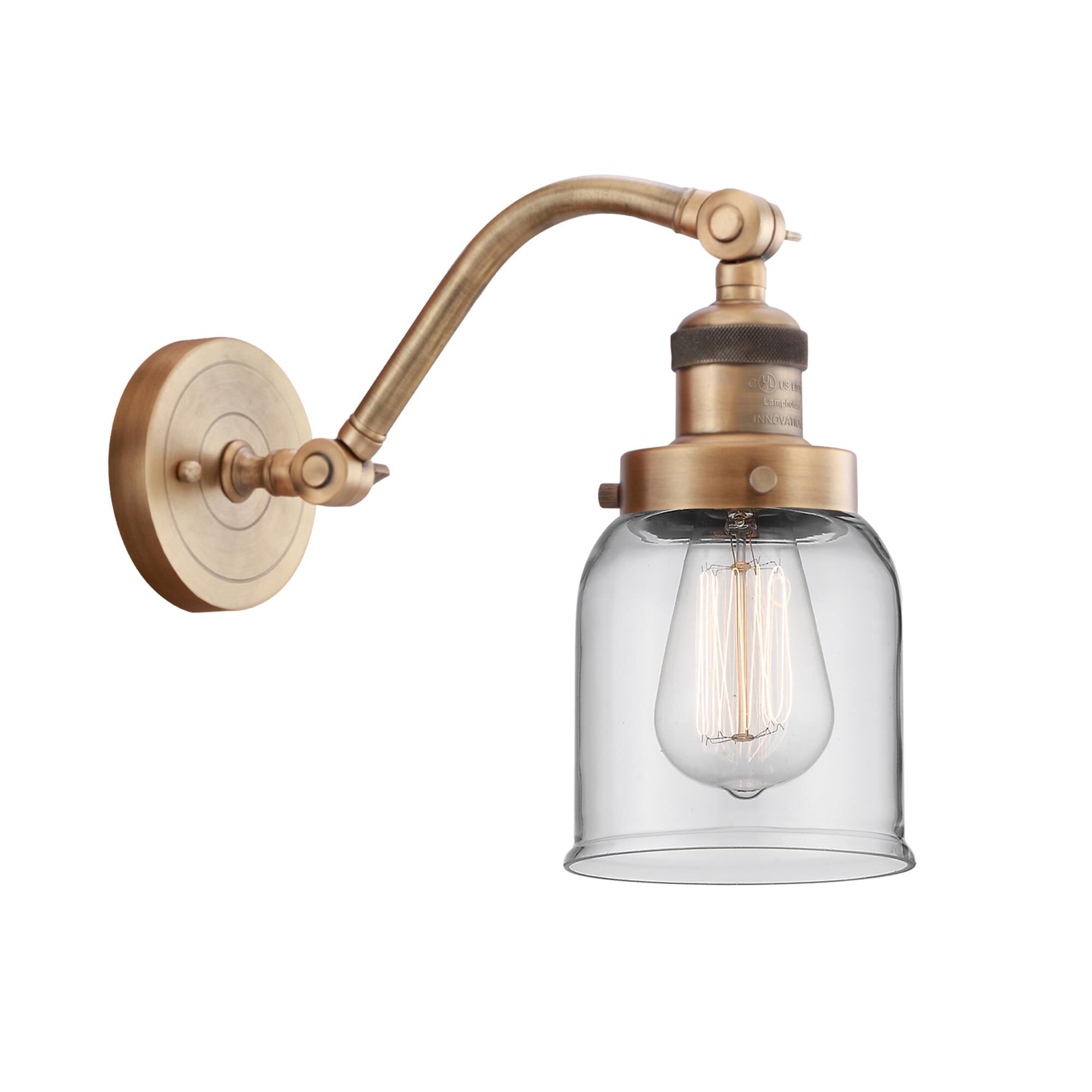Shown in Brushed Brass finish and Clear Small Bell glass