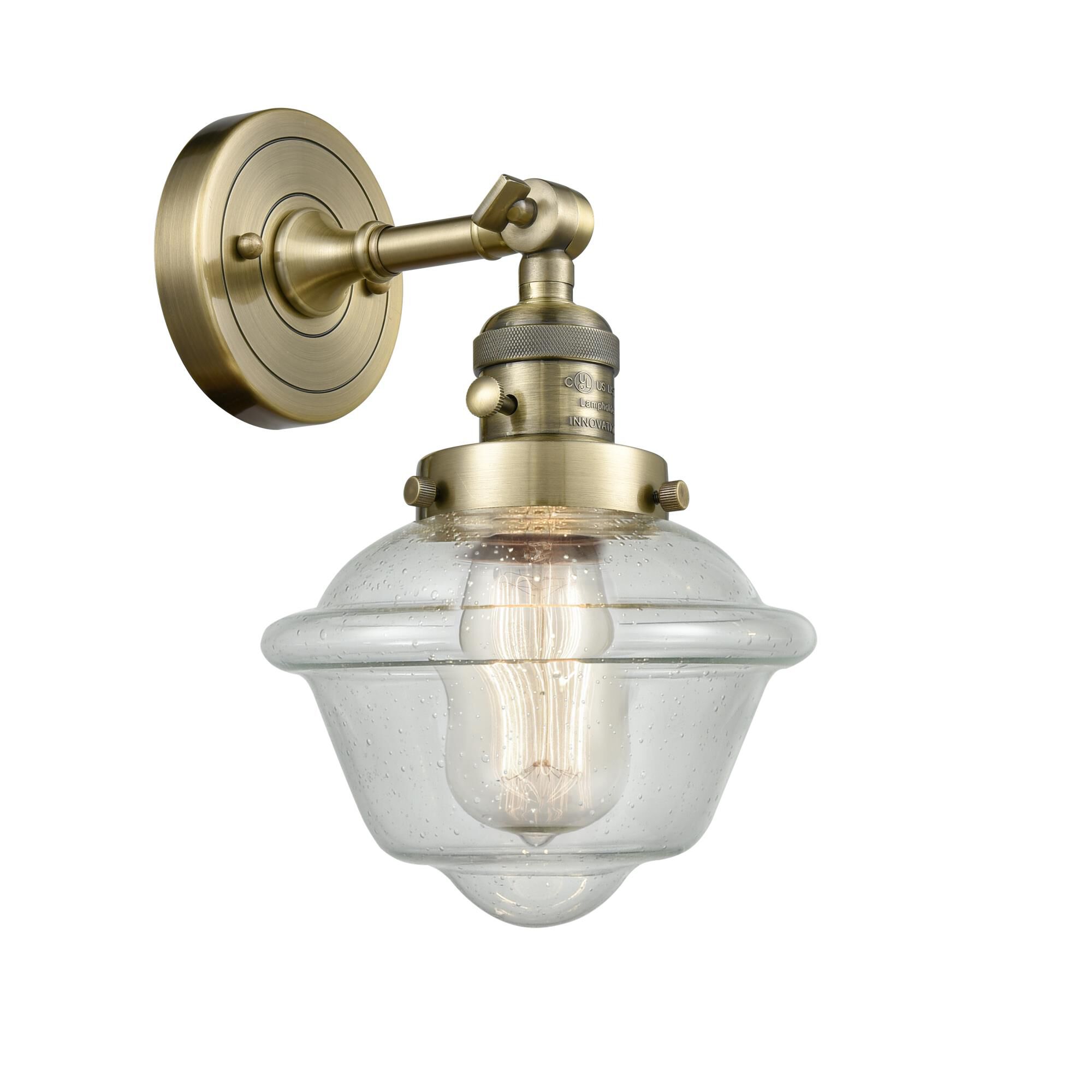 Shown in Antique Brass finish and Seedy glass and Switch on Socket accent