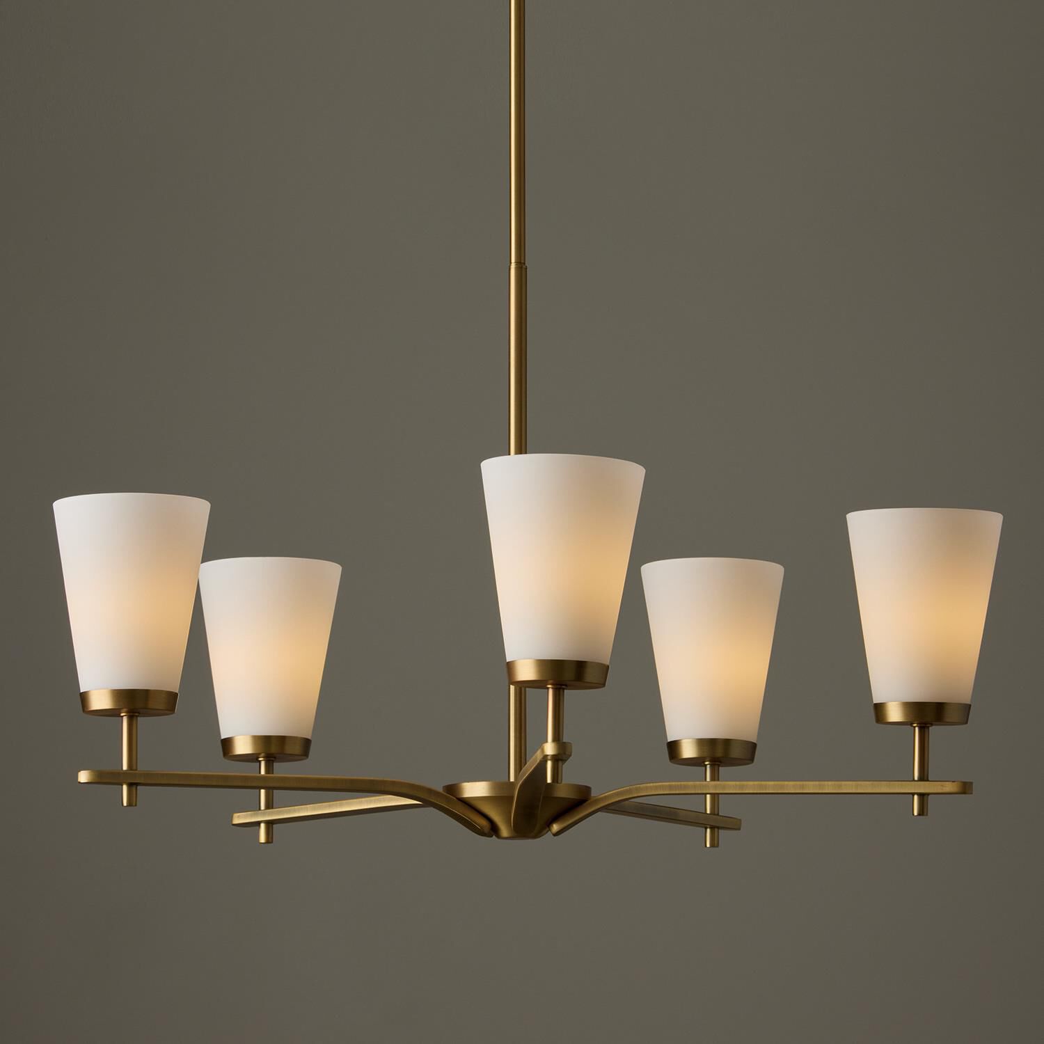 Shown in Aged Brass finish and Soft White glass