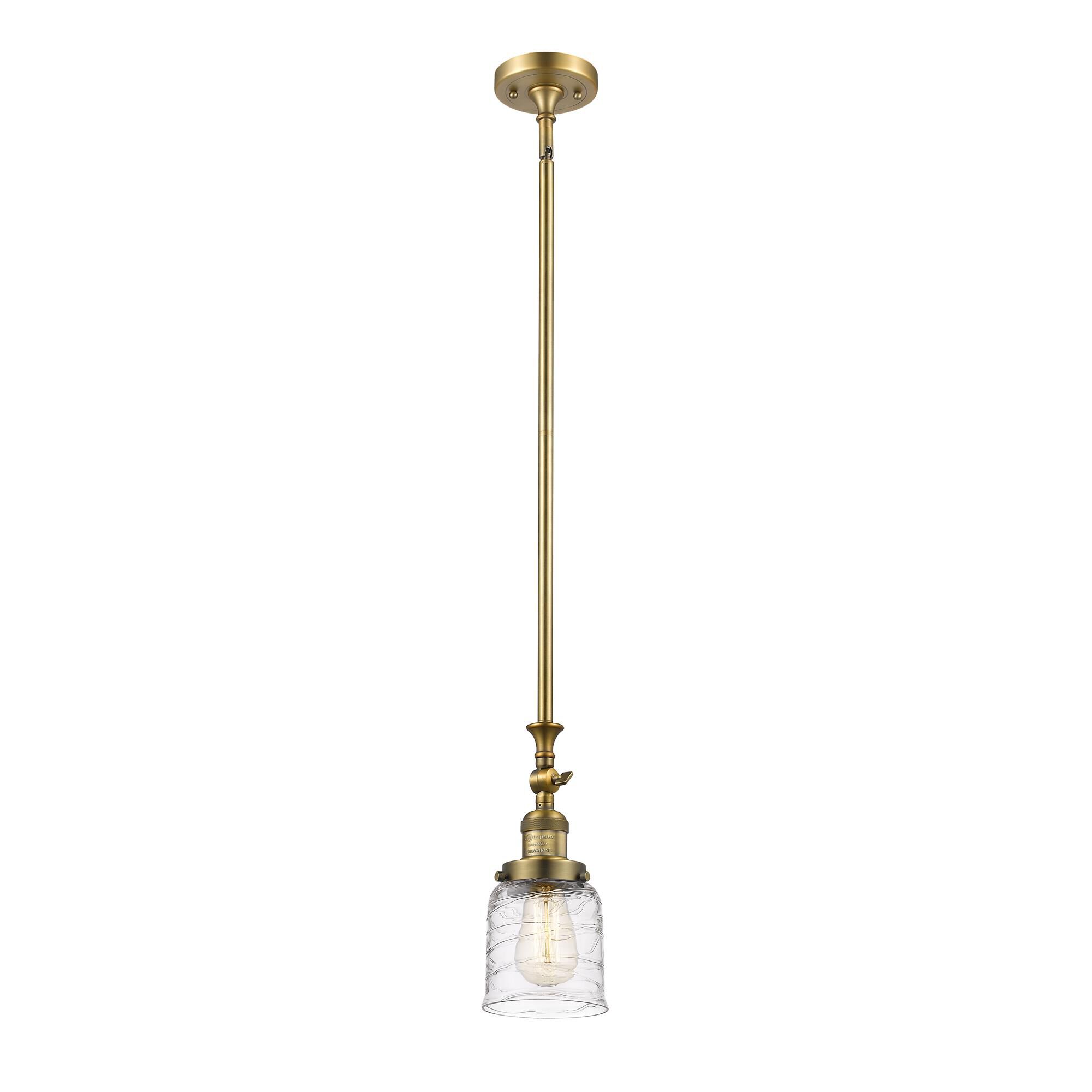Shown in Brushed Brass finish and Clear Deco Swirl glass