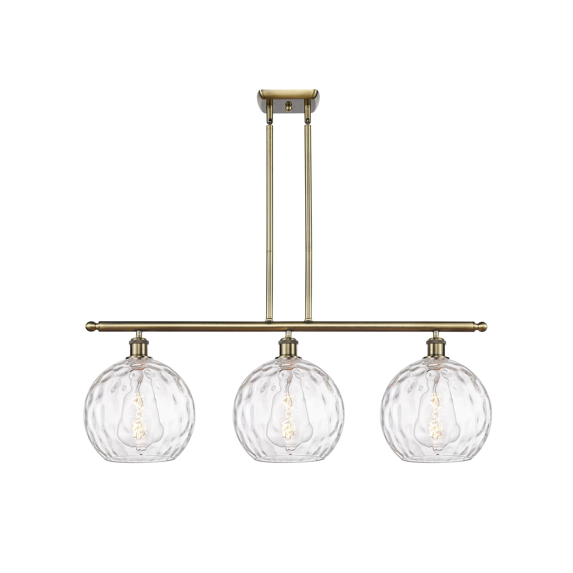 Shown in Antique Brass finish and Clear glass