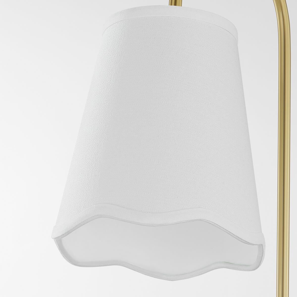 Shown in Aged Brass finish and White Linen shade