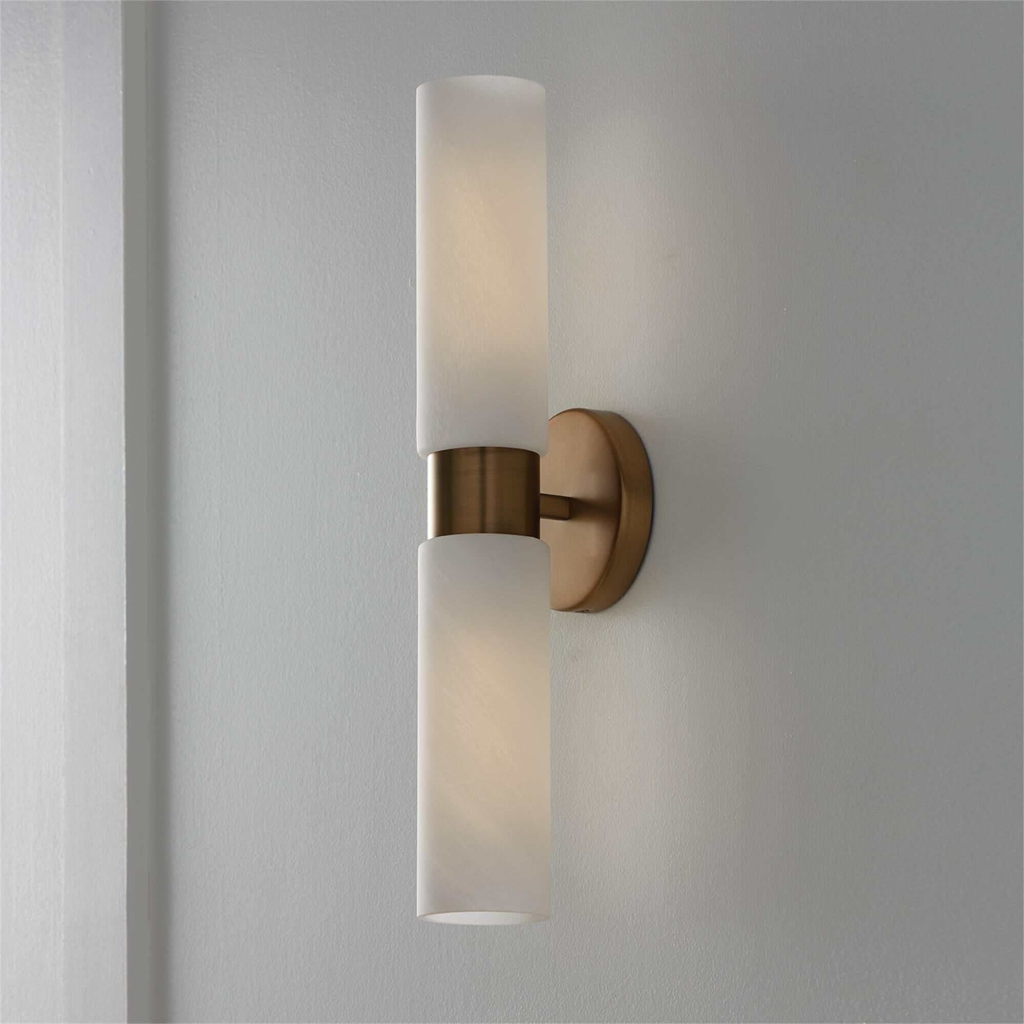 Shown in Aged Brass finish and Faux Alabaster glass