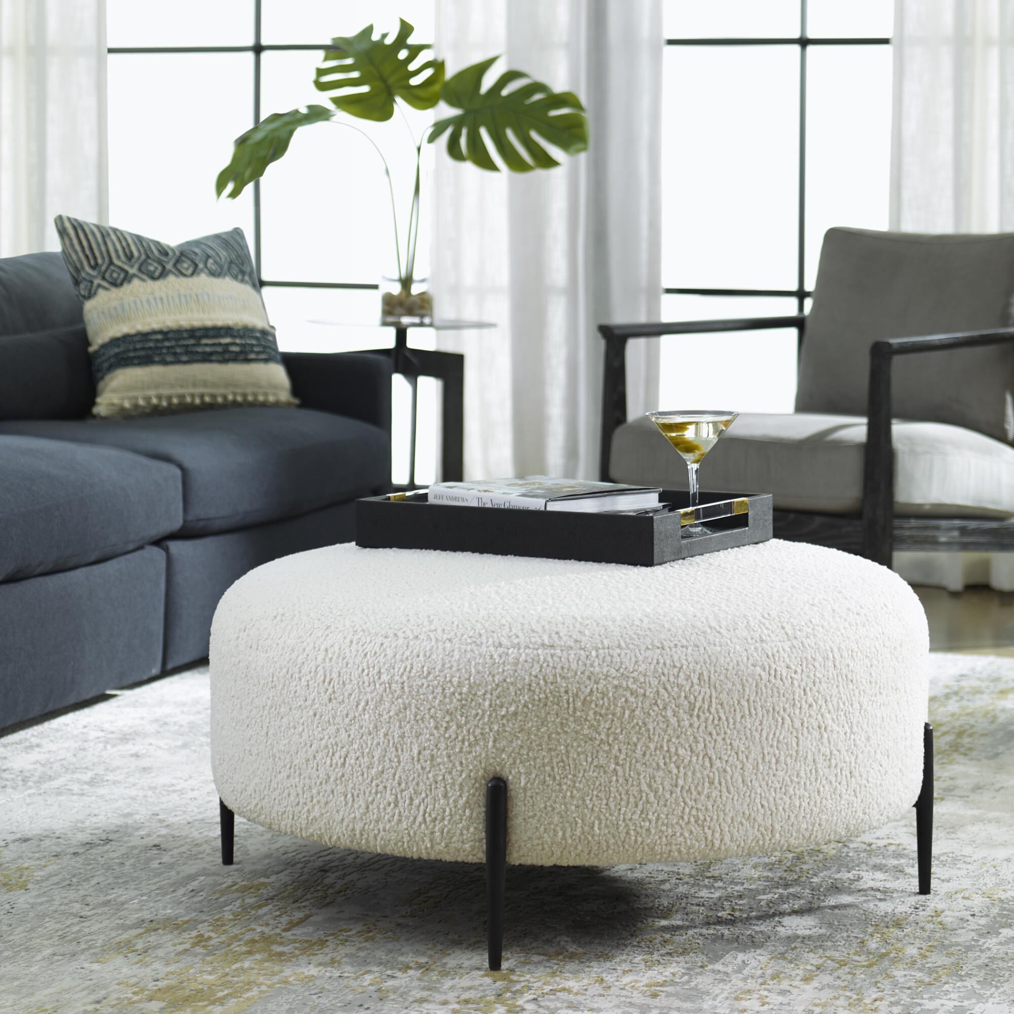 Shown in This Plush Ottoman Is Covered In A Luxurious White Faux Shearling, Suspended Within Satin Black Fini finish