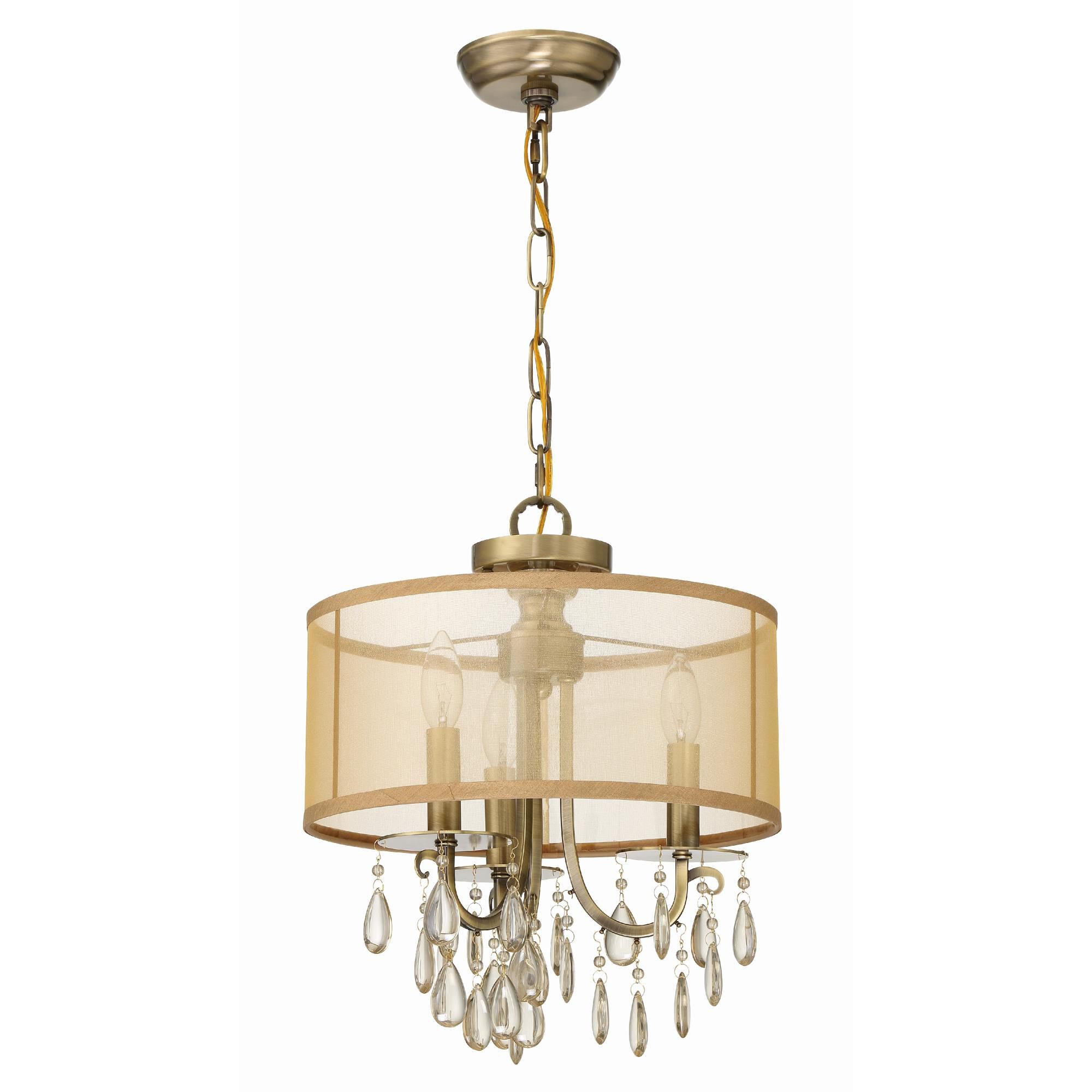 Shown in Antique Brass finish and Etruscan Teardrop Almond crystal and Silk glass and Translucent Gold shade