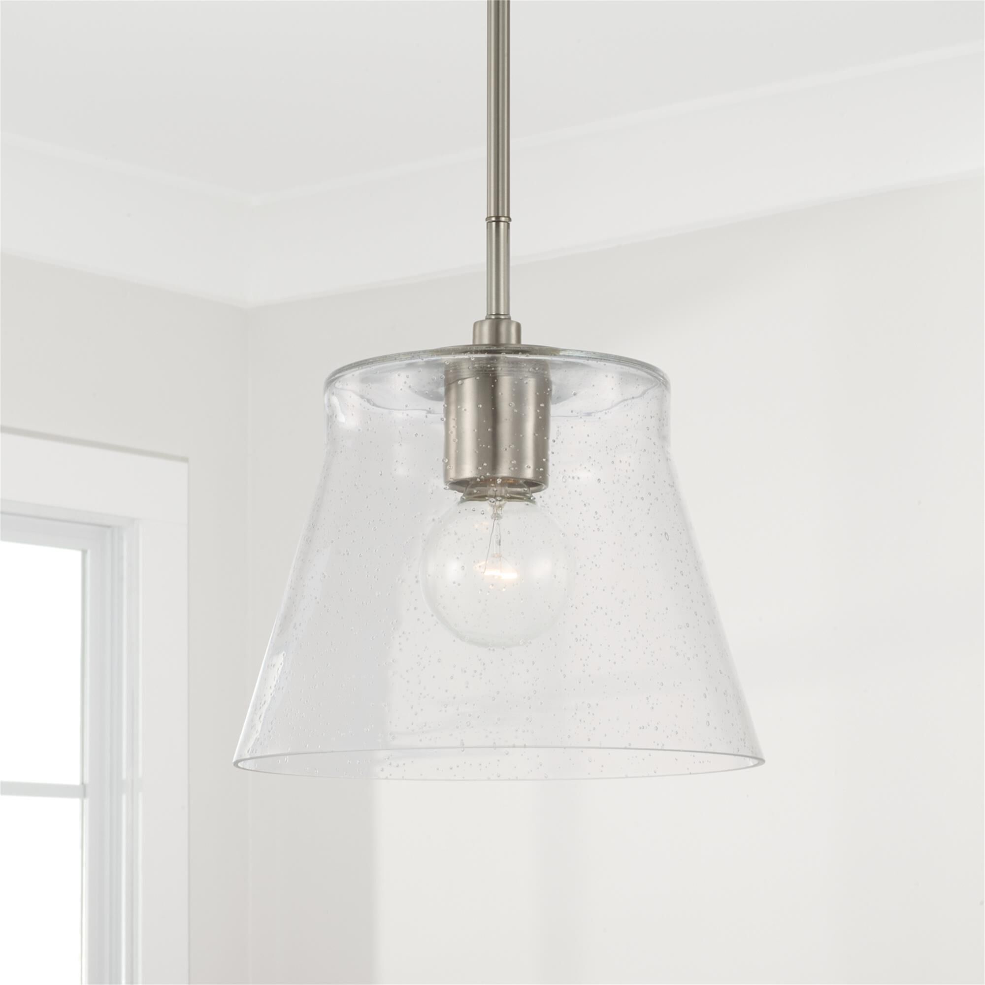 Shown in Brushed Nickel finish and Clear Seeded glass