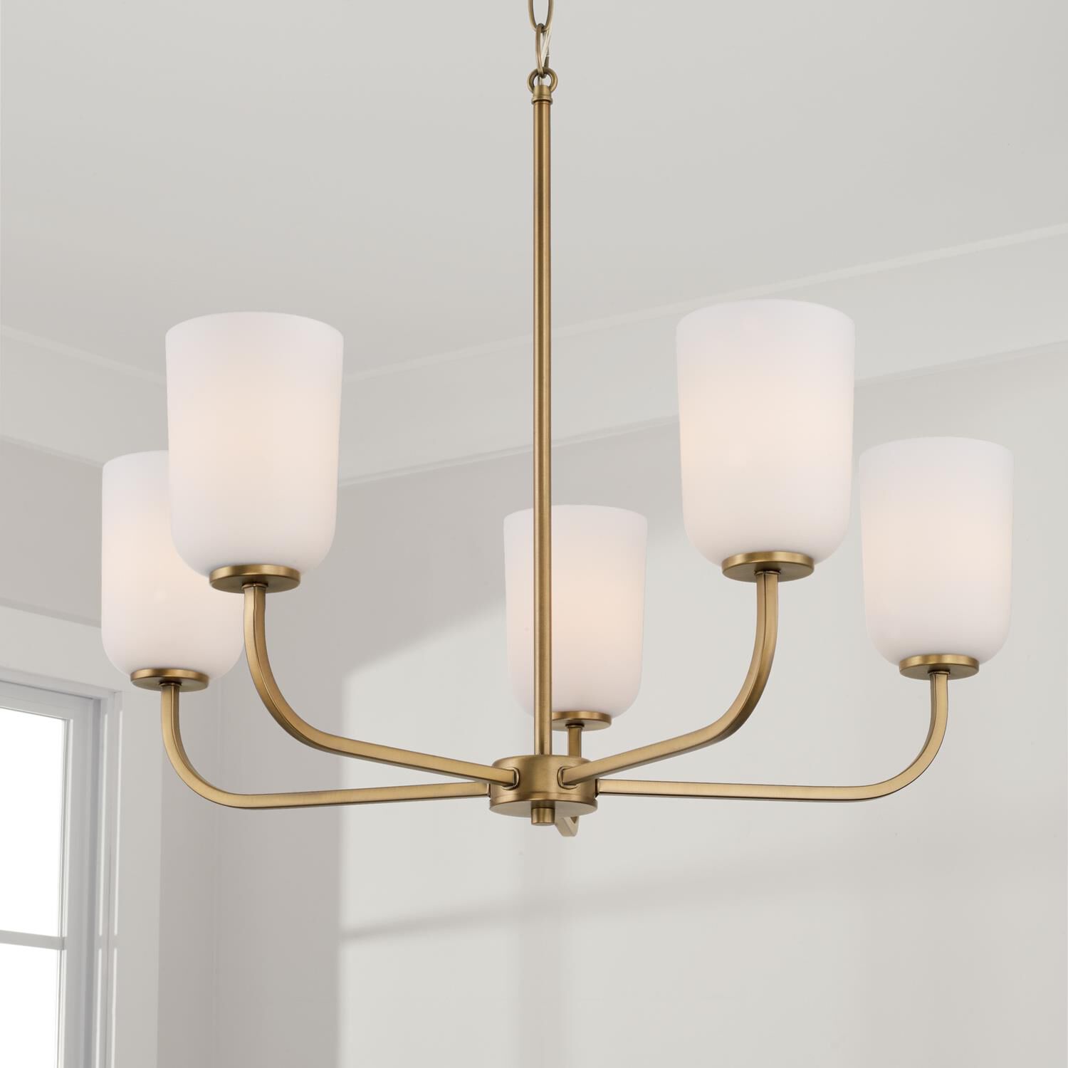 Shown in Aged Brass finish and Soft White glass