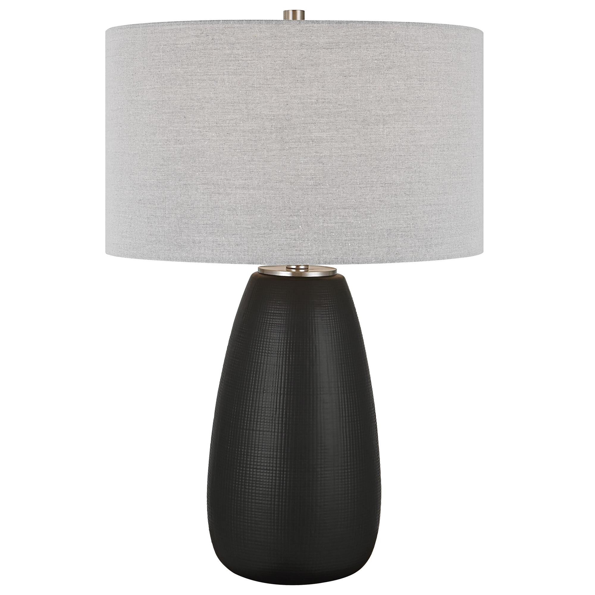 Shown in The Twilight Table Lamp Features A Ceramic Base With A Subtle Carved Gridline Texture, Finished In A finish and Round Hardback Drum shade