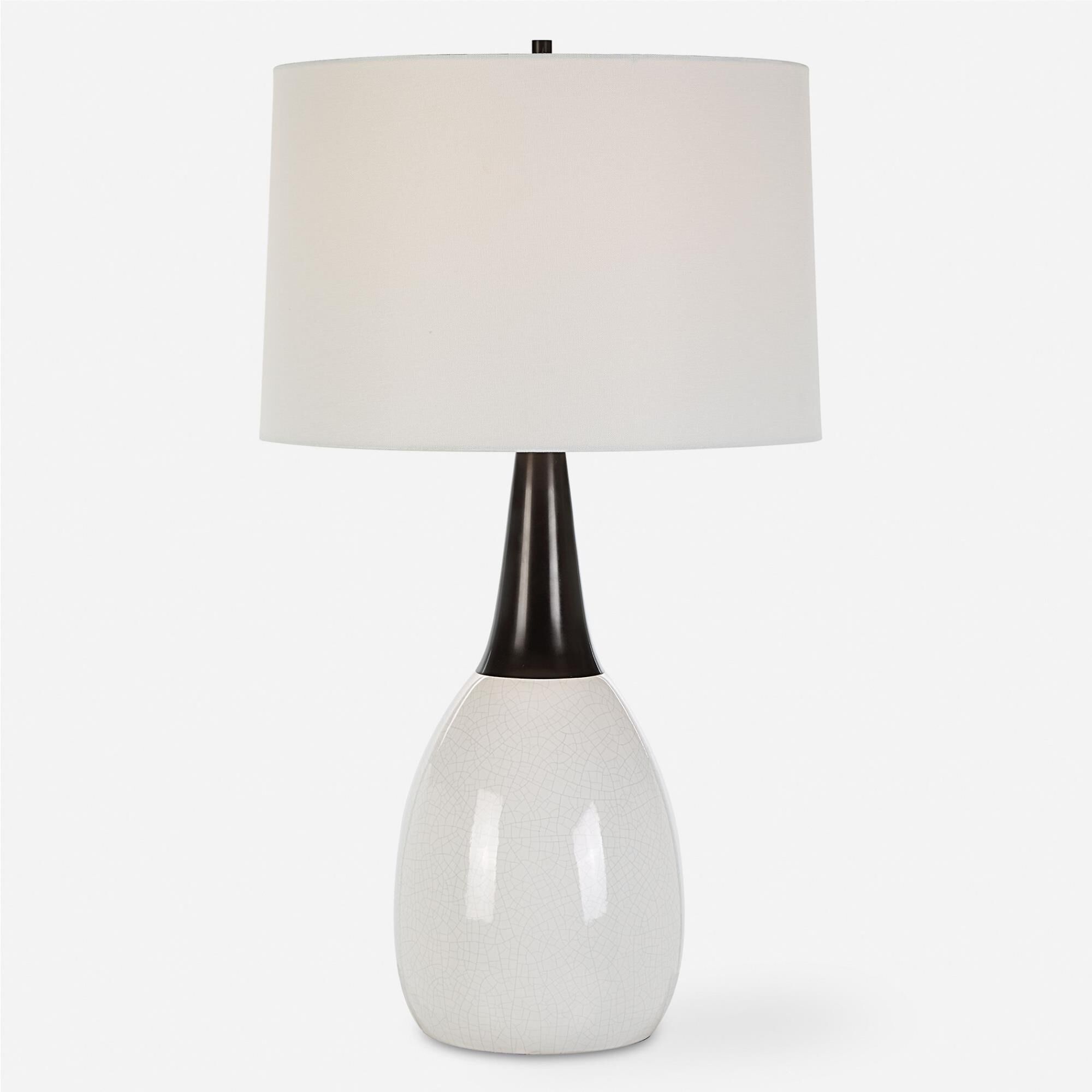 Shown in This Unique Table Lamp Seamlessly Blends Elegance And Uniqueness Into One Captivating Design. The Cr finish and Round Hardback shade