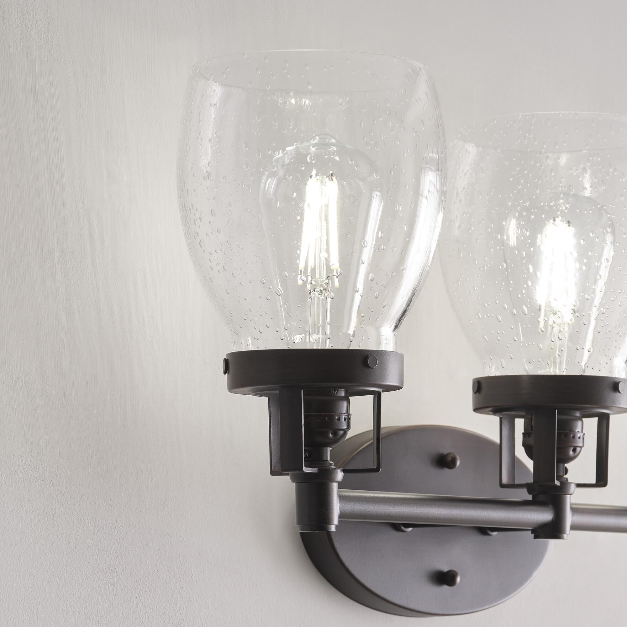 Shown in Bronze finish and Clear Seeded glass