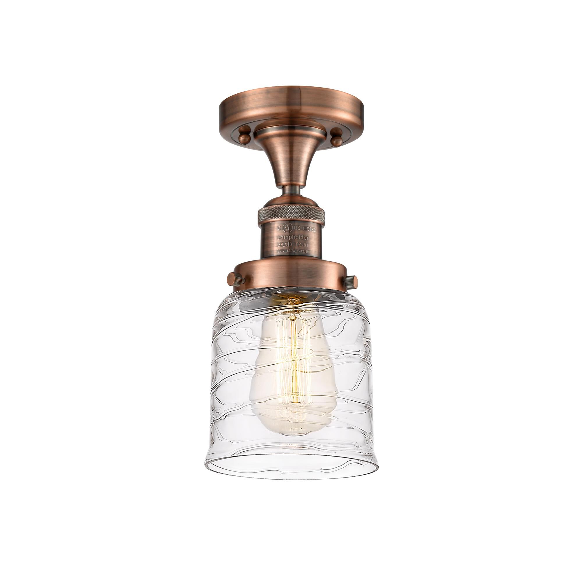 Shown in Antique Copper finish and Clear Deco Swirl Small Bell glass