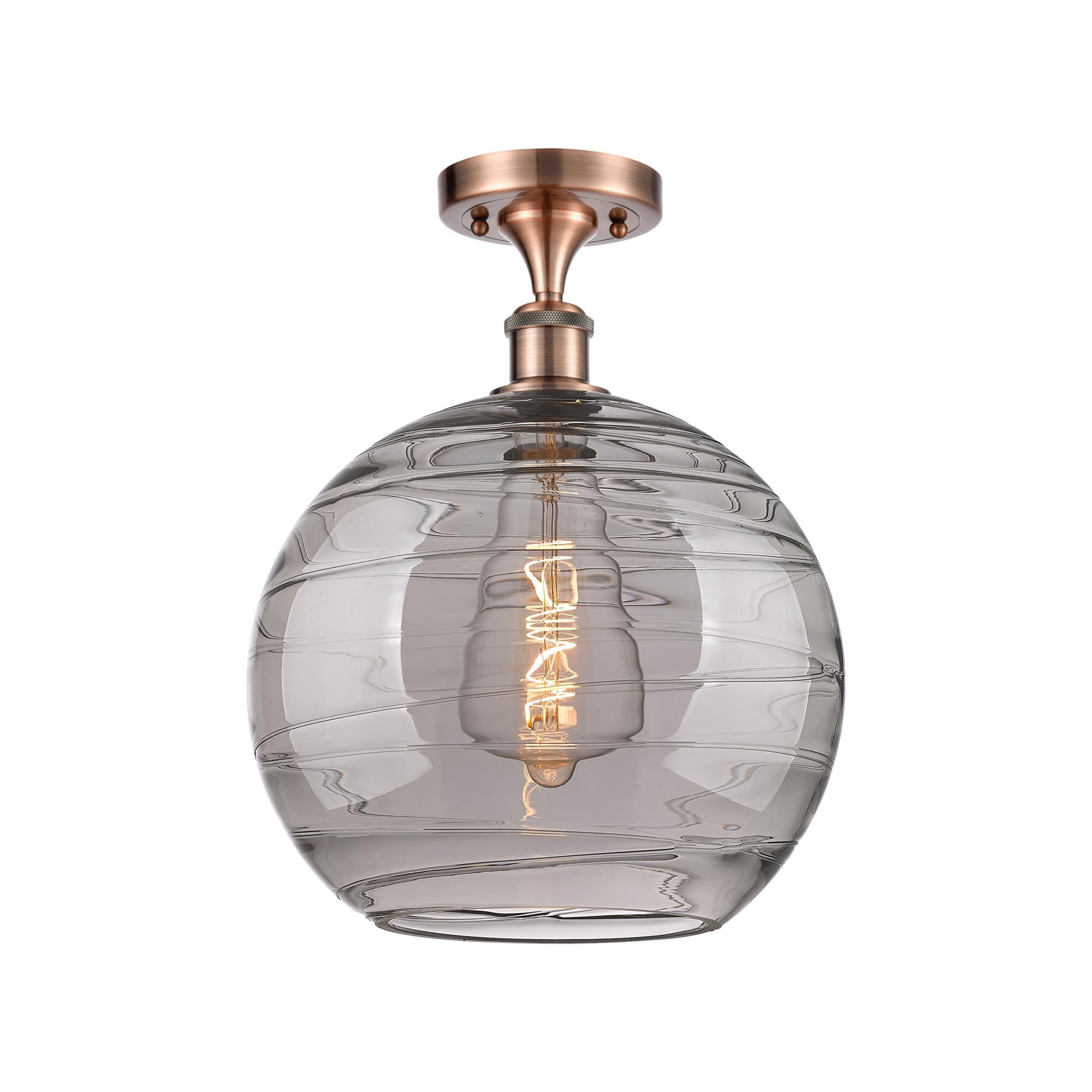 Shown in Antique Copper finish and Light Smoke Deco Swirl glass
